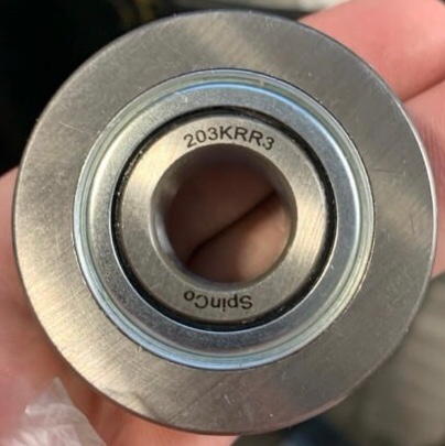 Condition photo showing New/Like New for 203KRR3 agricultural bearing, which is used for planters, gauge wheels, and rotary hoes