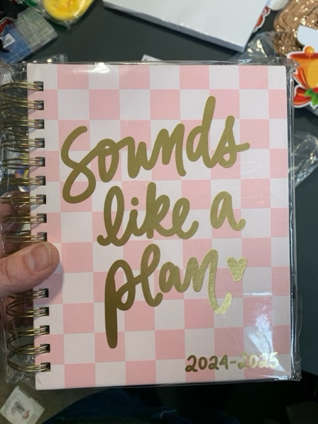 Condition photo showing New/Like New for 2024-2025 Eccolo Spiral Agenda Planner, Sounds Like A Plan, 18 Months, Weekly & Monthly Views, Stickers, Color Graphics and Quotes (7.75 x 8.75, Hardcover, July 2024 - Dec 2025)