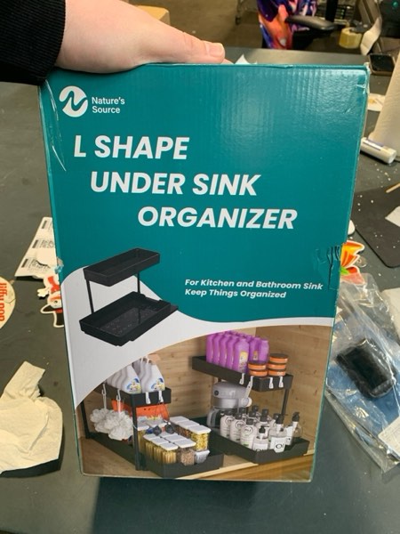 Condition photo showing New/Like New for 2 Pack Under Sink Organizer 2 Tier Sliding Cabinet Organizers Multi-Purpose Sink Storage Basket L-Shape Narrow Space Storage Shelves with 4 Hook for Kitchen Bathroom Drawer, Black 2 pack Black