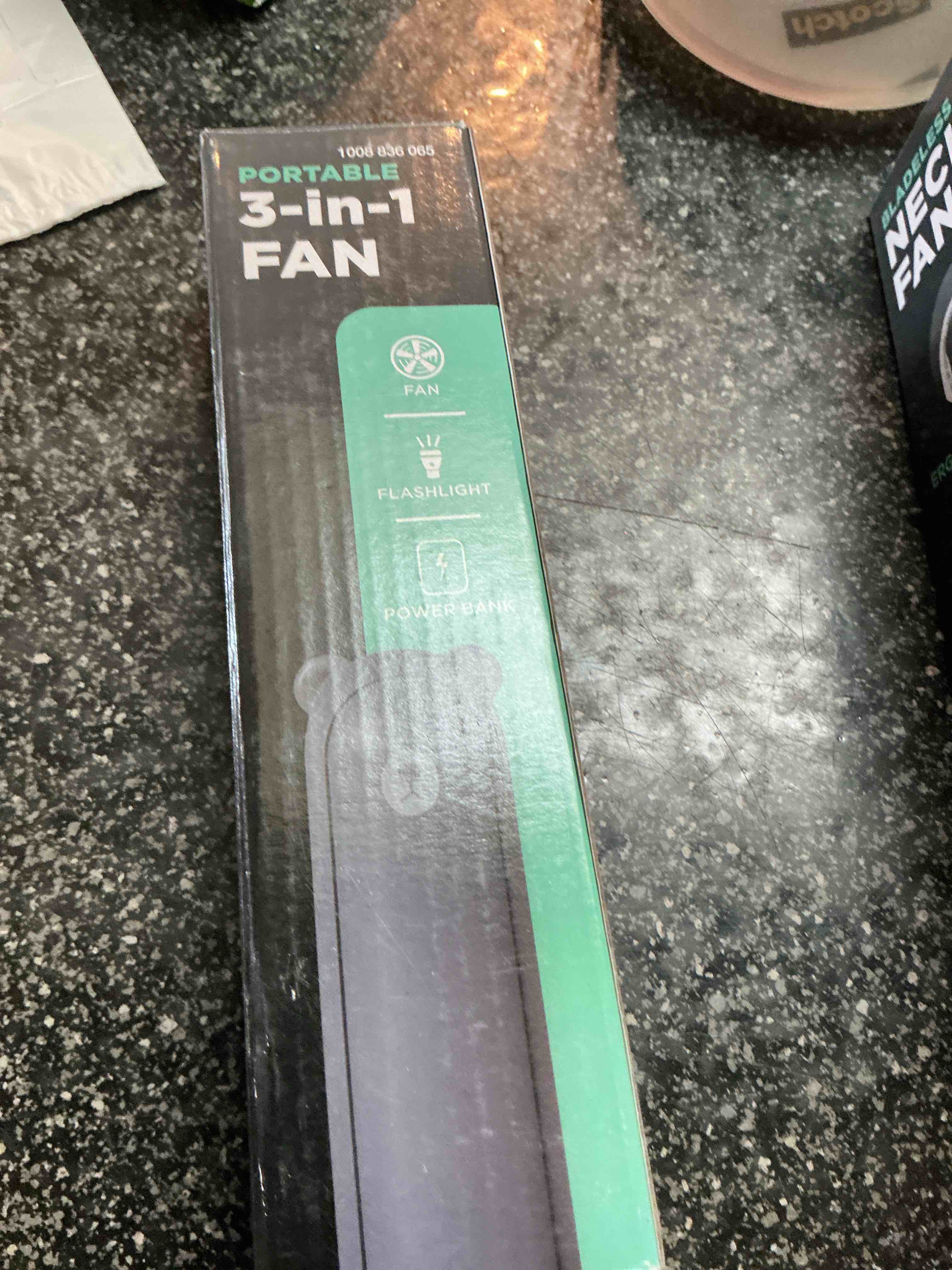 portable 3 - in - 1 fan black has flashlight power bank 