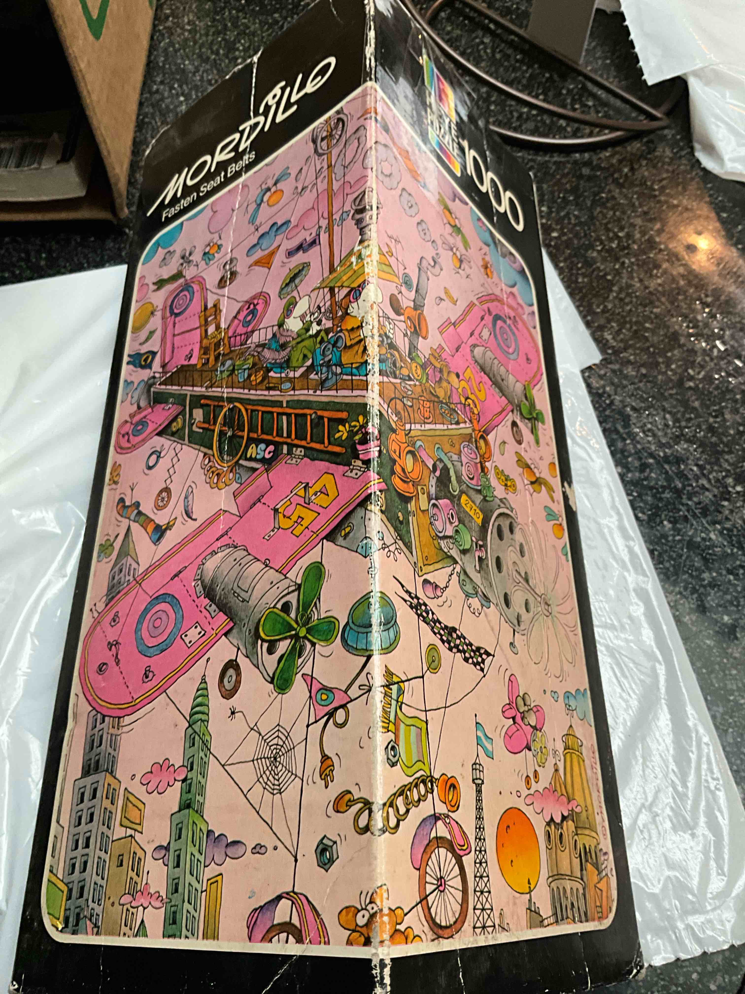 Mordillo - Fasten Seat Belts - 1000 pc Puzzle - 50 X 74 