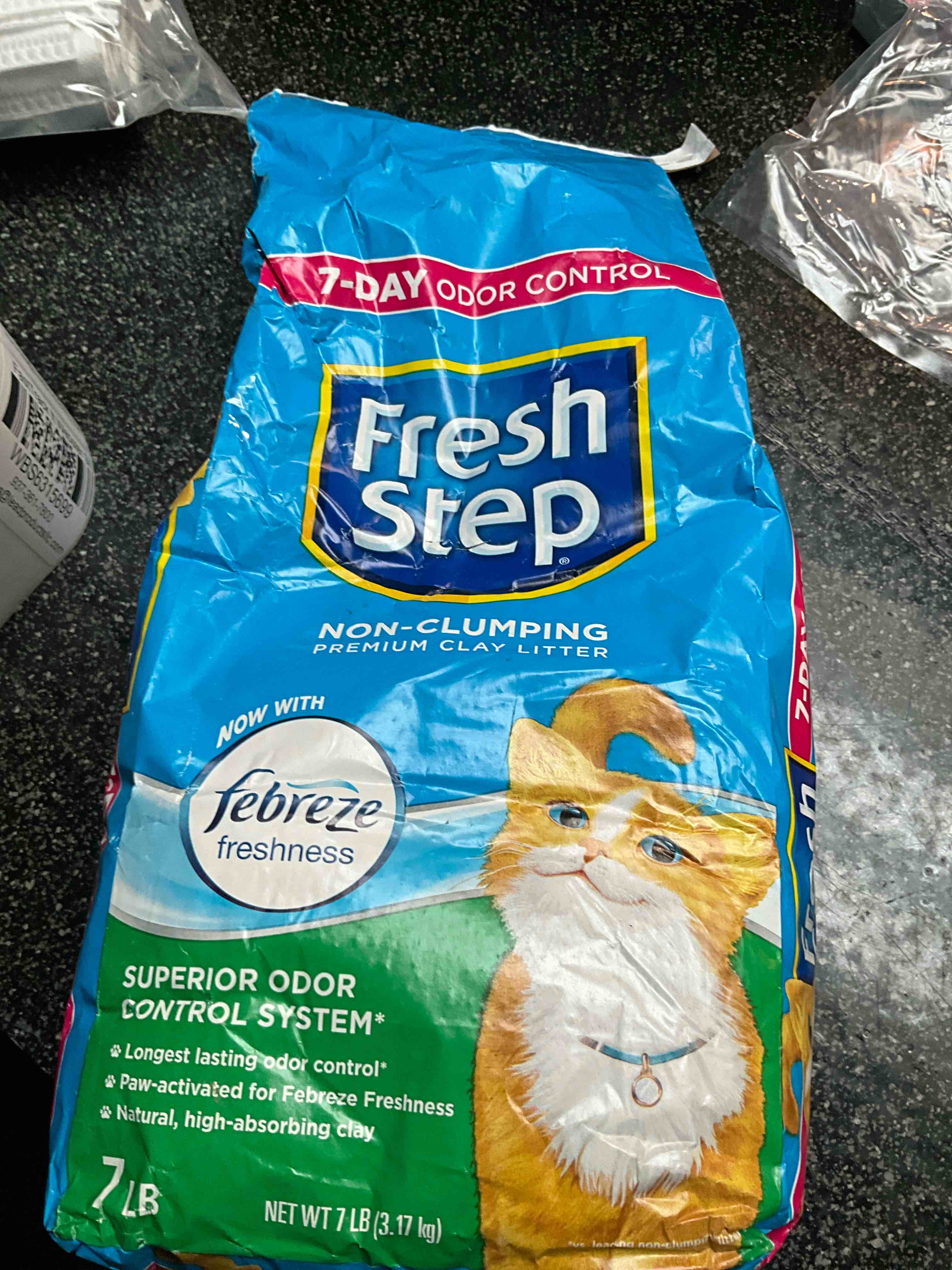 fresh step non clumping cat litter with febreze freshness, with 7-day odor control, 7 lb. bag