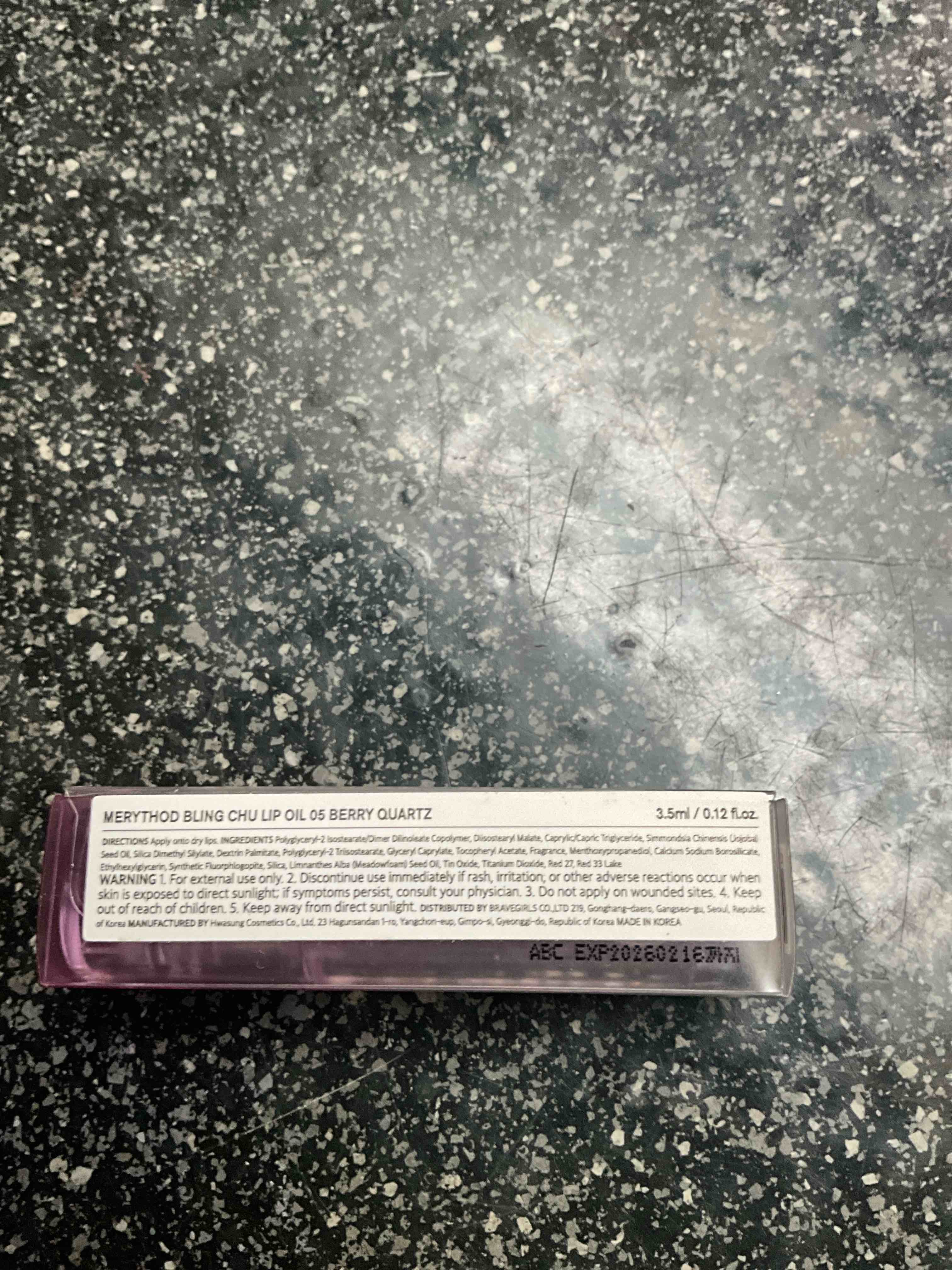Condition photo showing New/Like New for MERYTHOD - Bling Chu Lip Oil - Berry Quartz .12 oz 