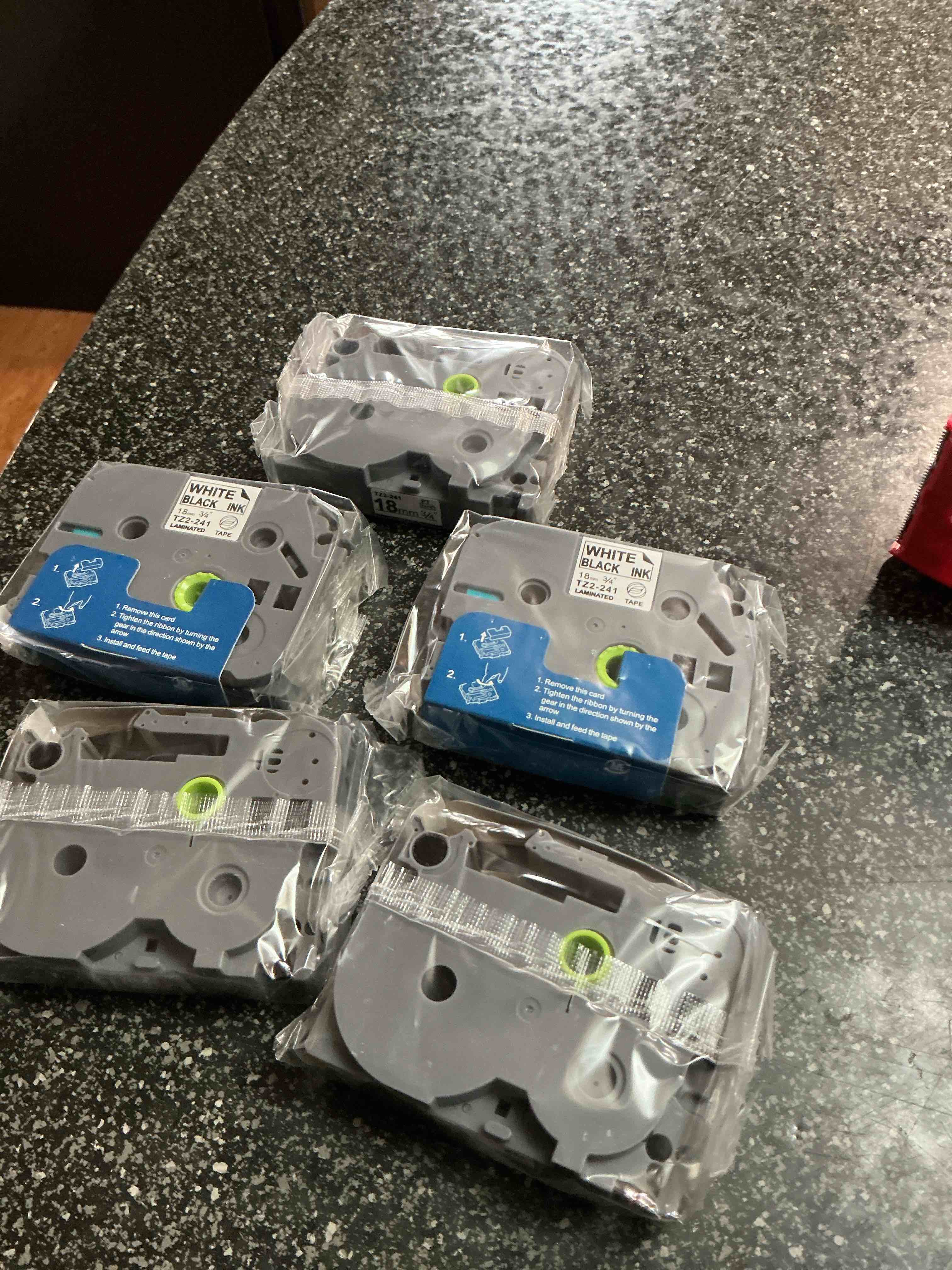 Condition photo showing New/Like New for Tape Label Cassette 12 MM.  Black On White