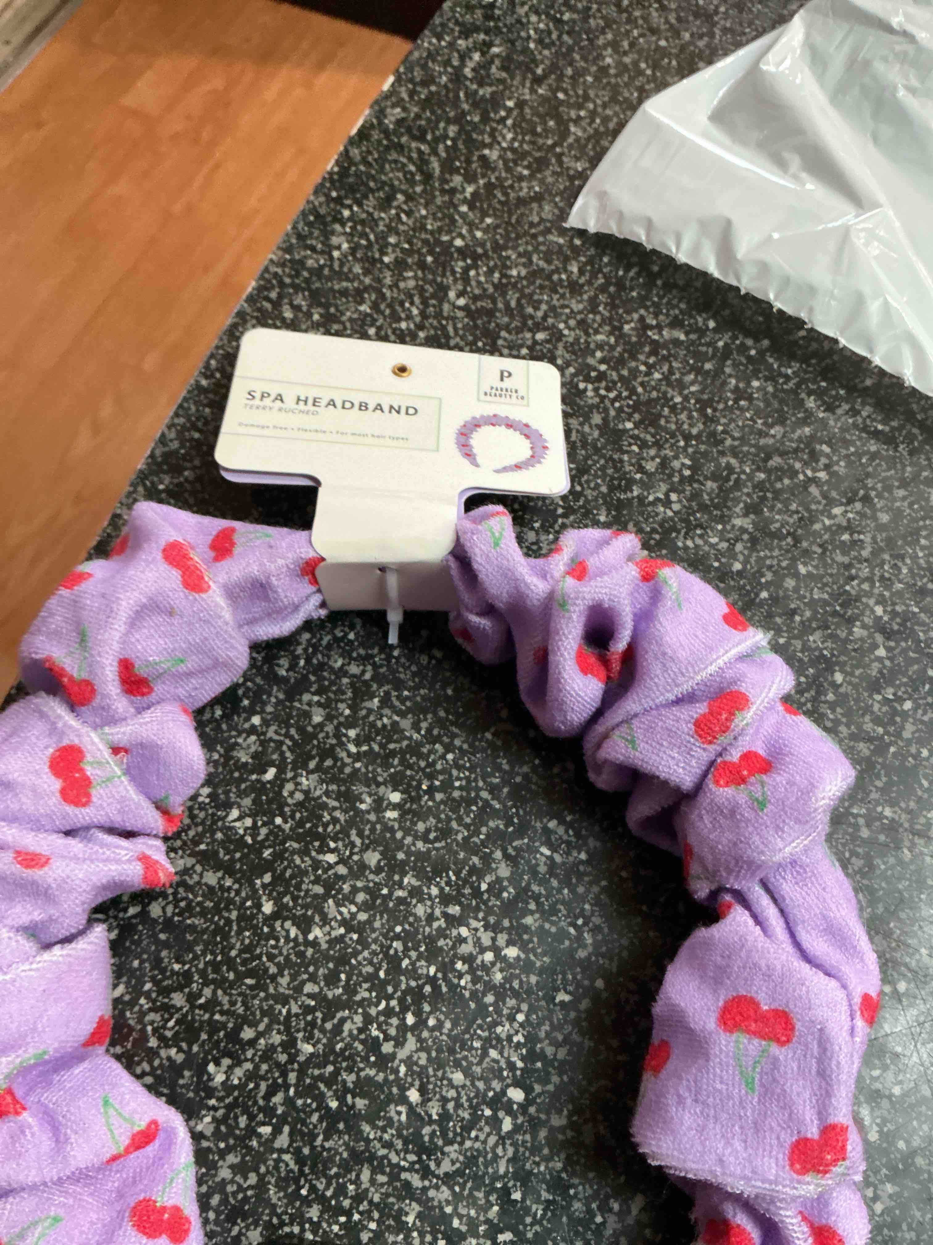 Condition photo showing New/Like New for SPA Headbands Purple With Cherry 