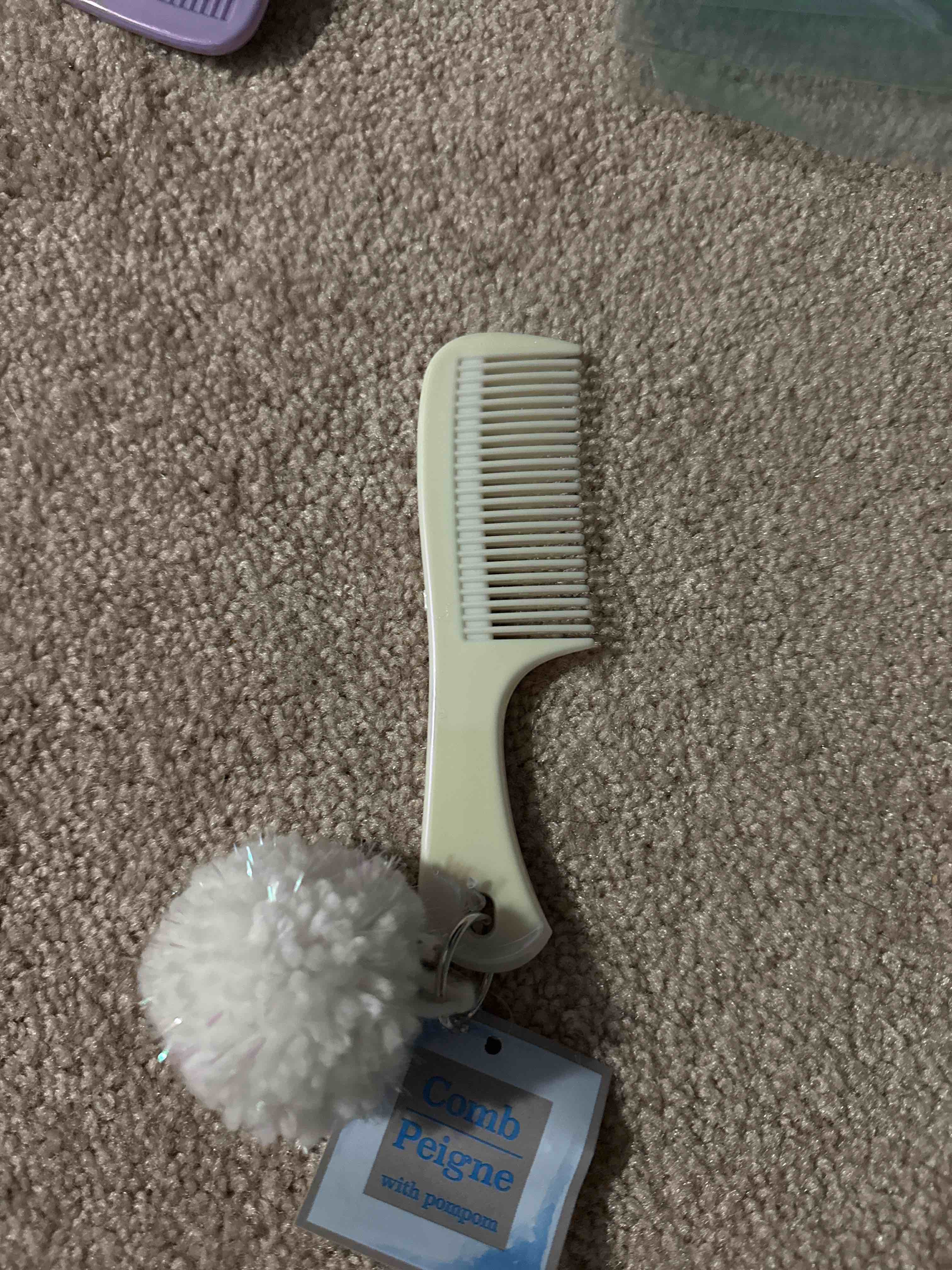 comb with pompom