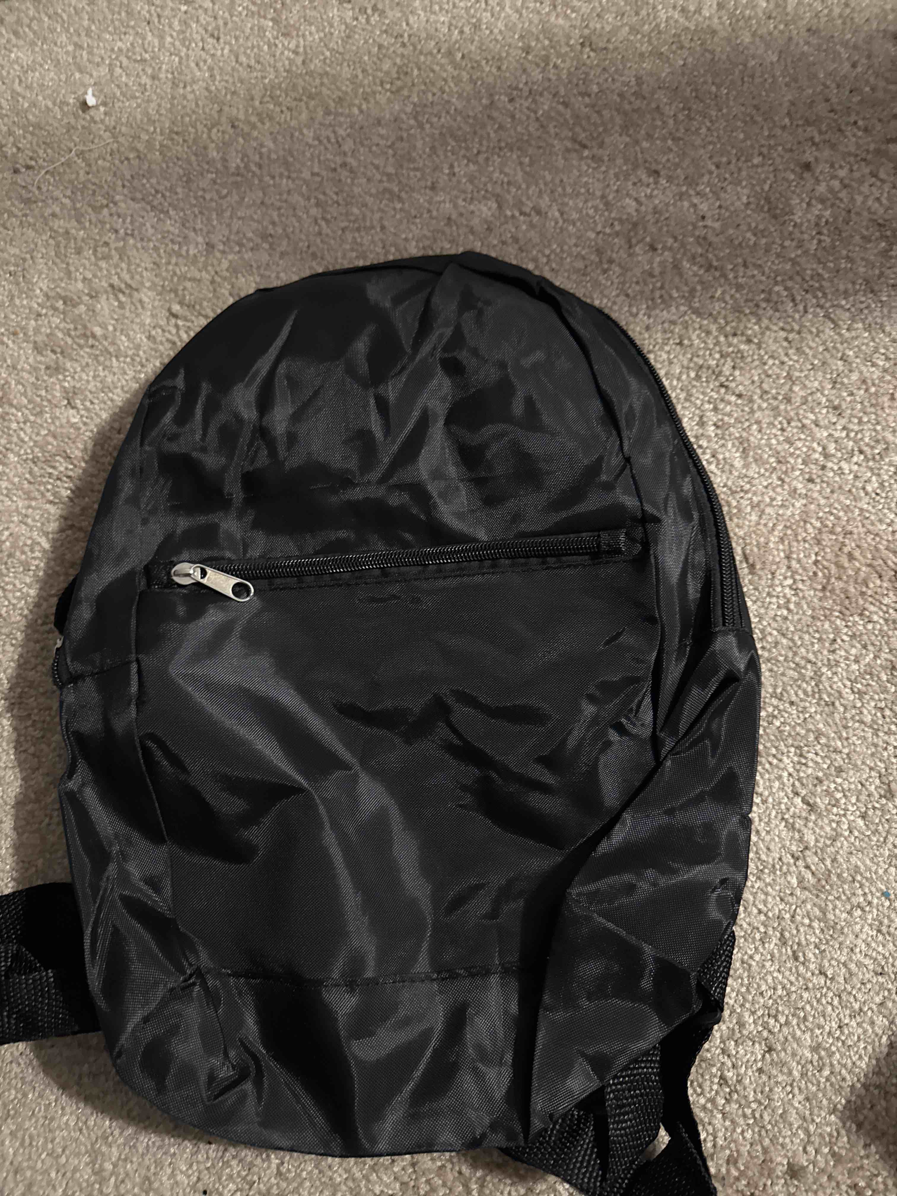 Condition photo showing New/Like New for black backpack 