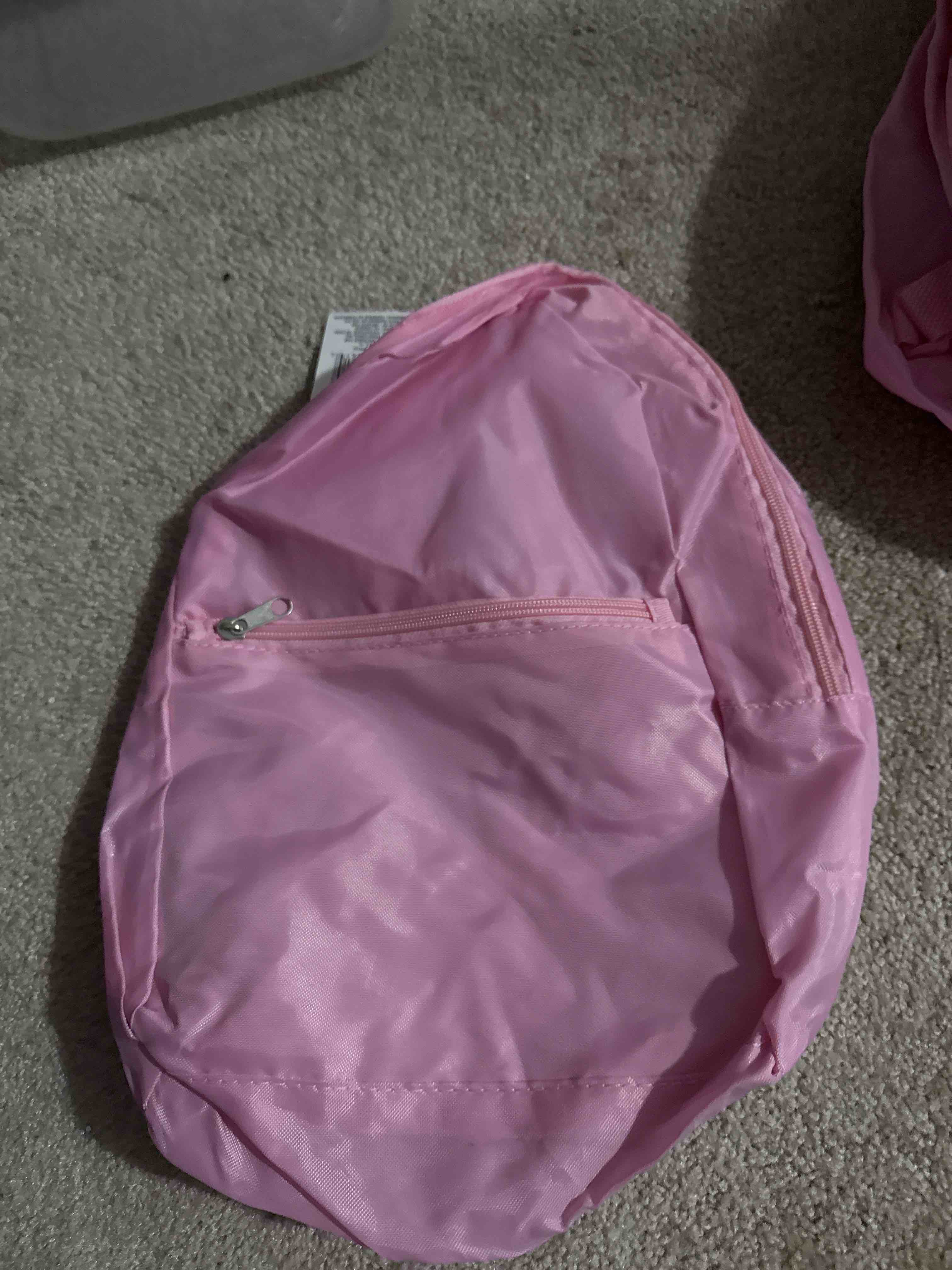 Condition photo showing New/Like New for light pink backpack