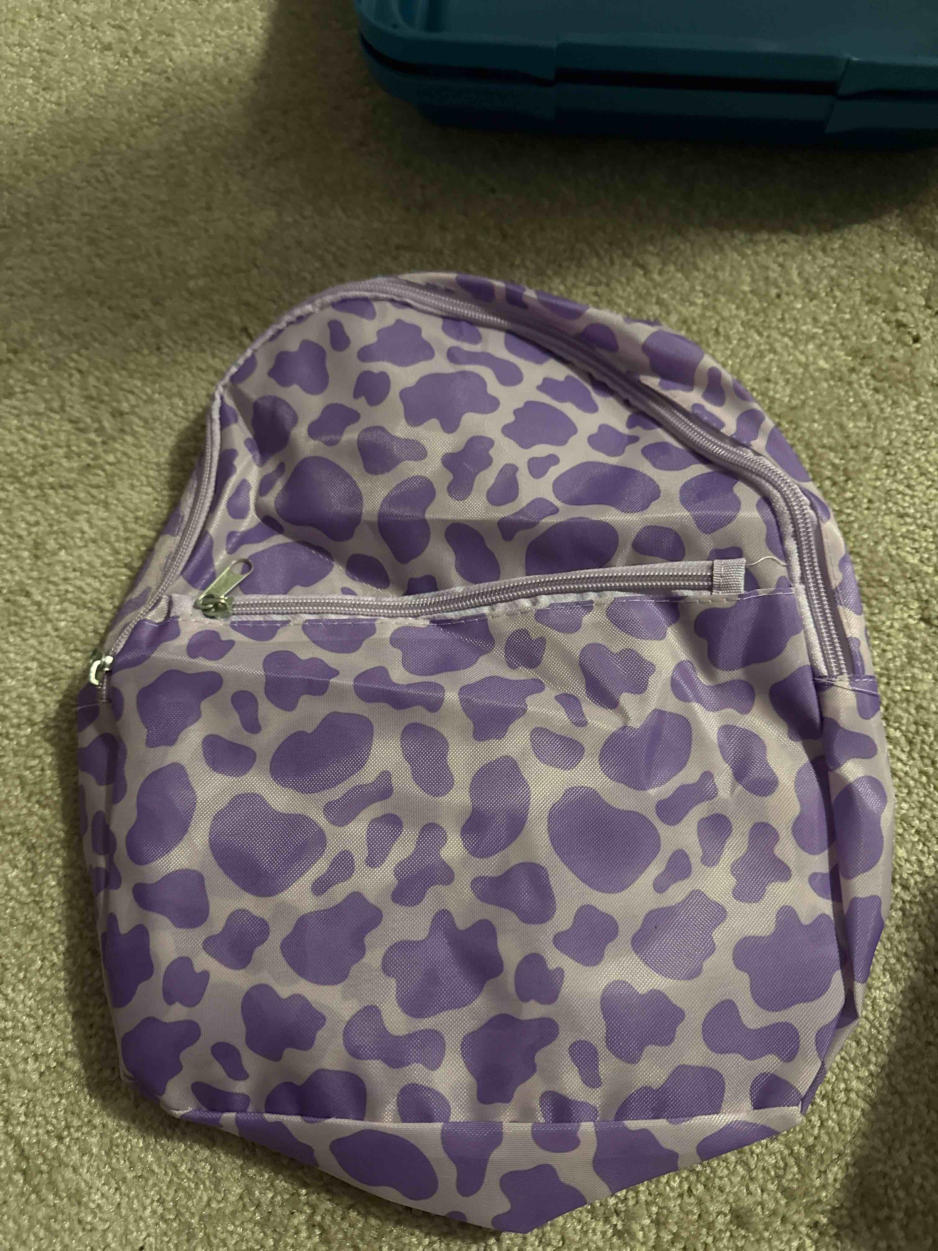 Condition photo showing New/Like New for purple backpack