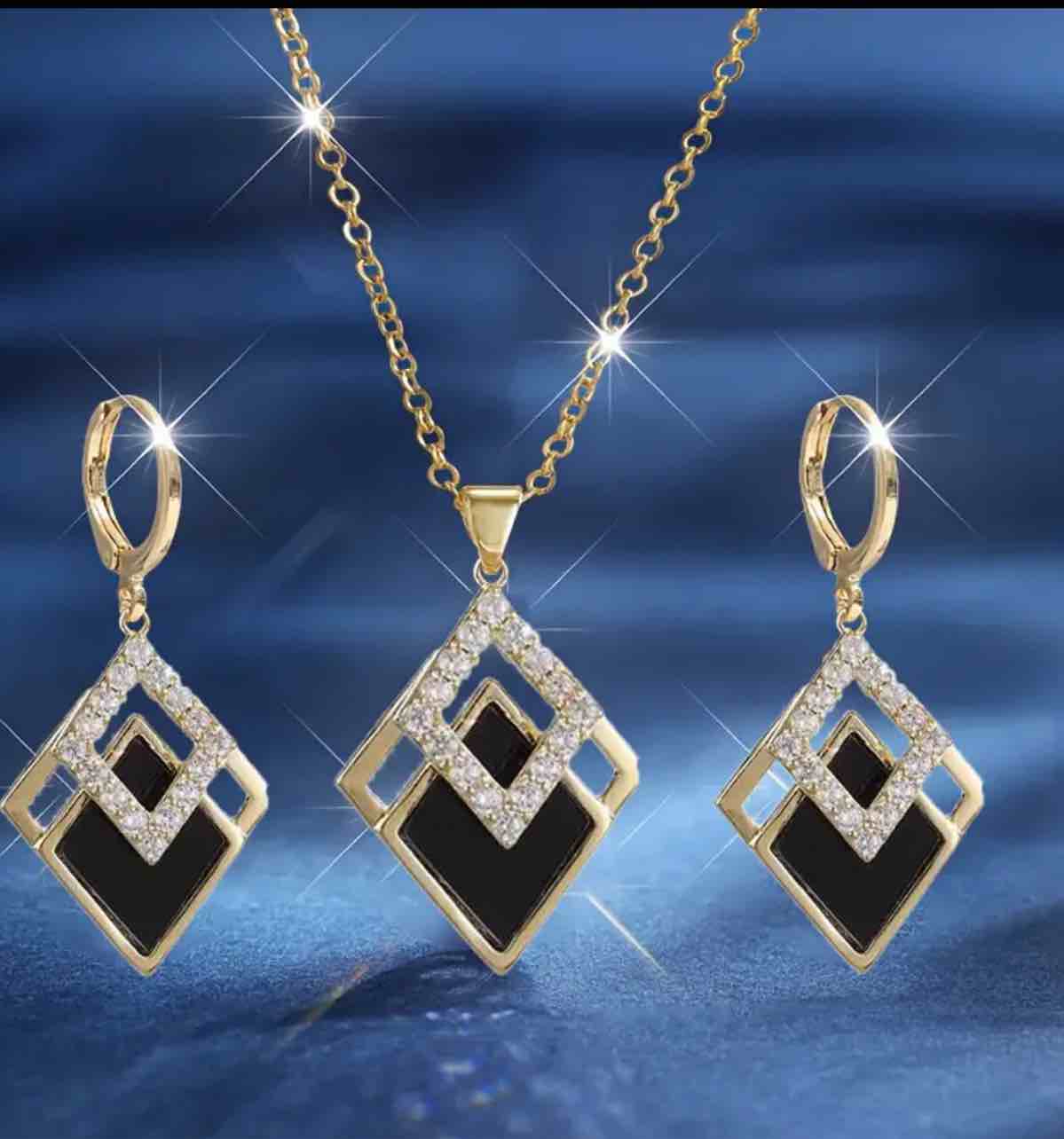 Elegant  18K Gold  Plated Set  featuring a necklace and matching earrings.