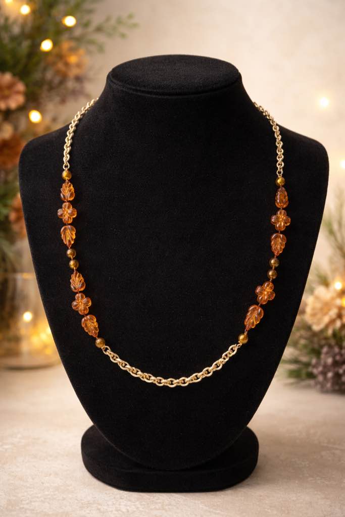 Condition photo showing New/Like New for Elegant 18k gold-tone chain necklace featuring carved amber floral and leaf beads