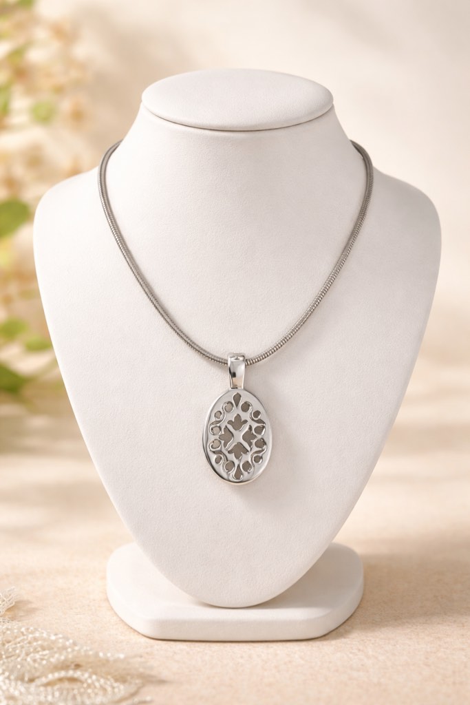 Condition photo showing New/Like New for Elegant 925 silver plated necklace featuring a sleek snake chain and a polished oval pendant with a delicate cutout design 
