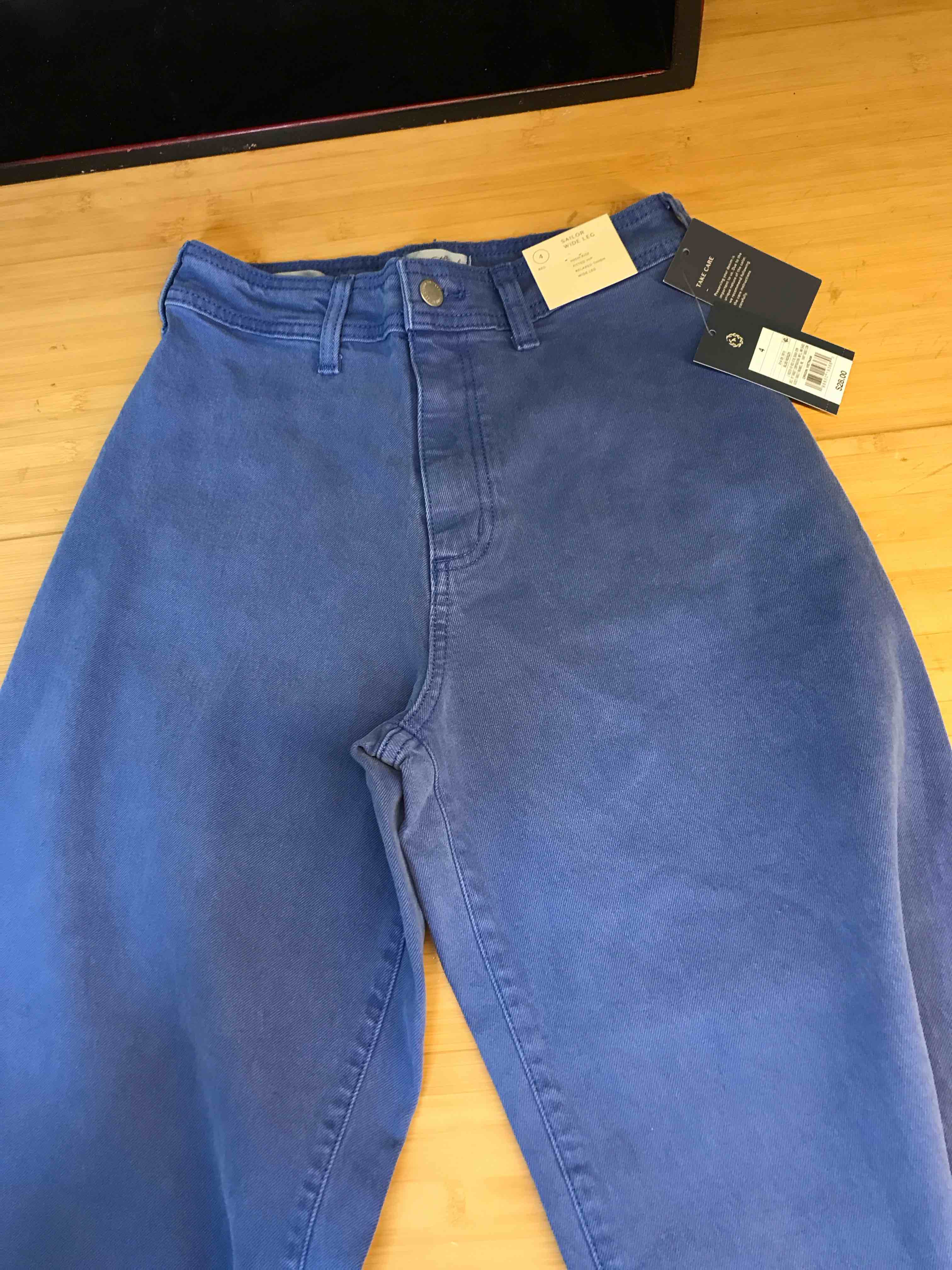 Condition photo showing New/Like New for Women's High-Rise Sailor Wide Leg Ankle Jeans - Universal Thread™ Blue 4: Relaxed Fit, Denim, 29" Inseam