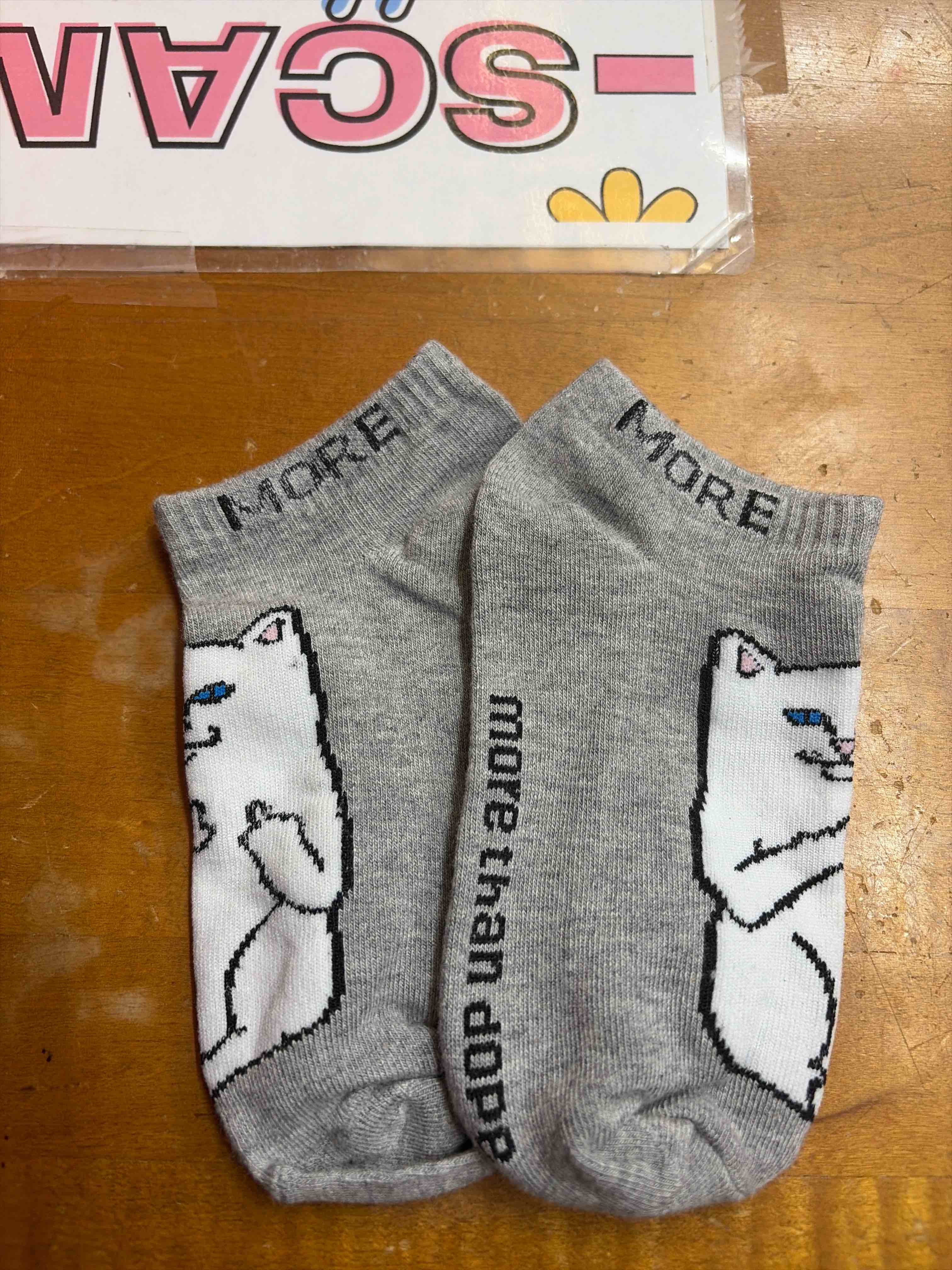 Condition photo showing New/Like New for middle finger cat socks 