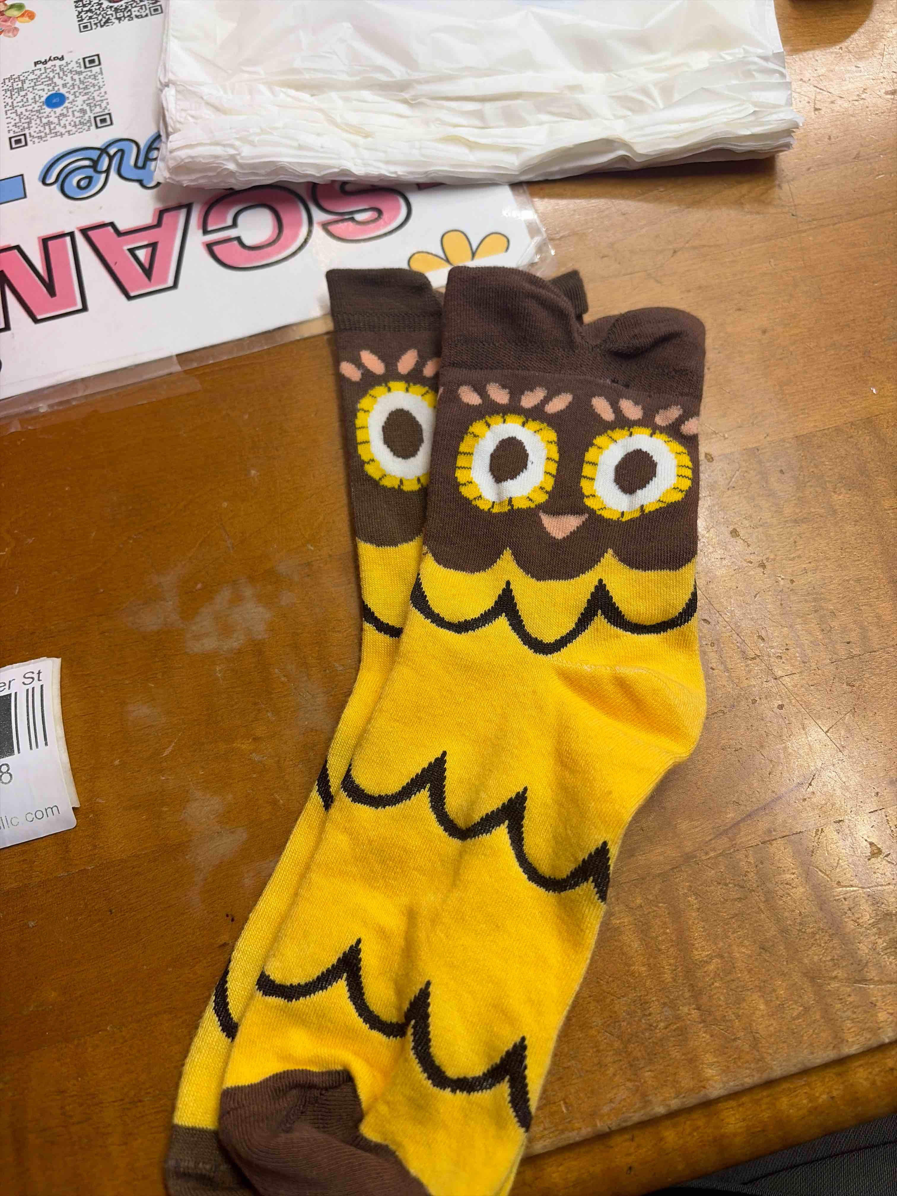 Condition photo showing New/Like New for owl socks adult sized 