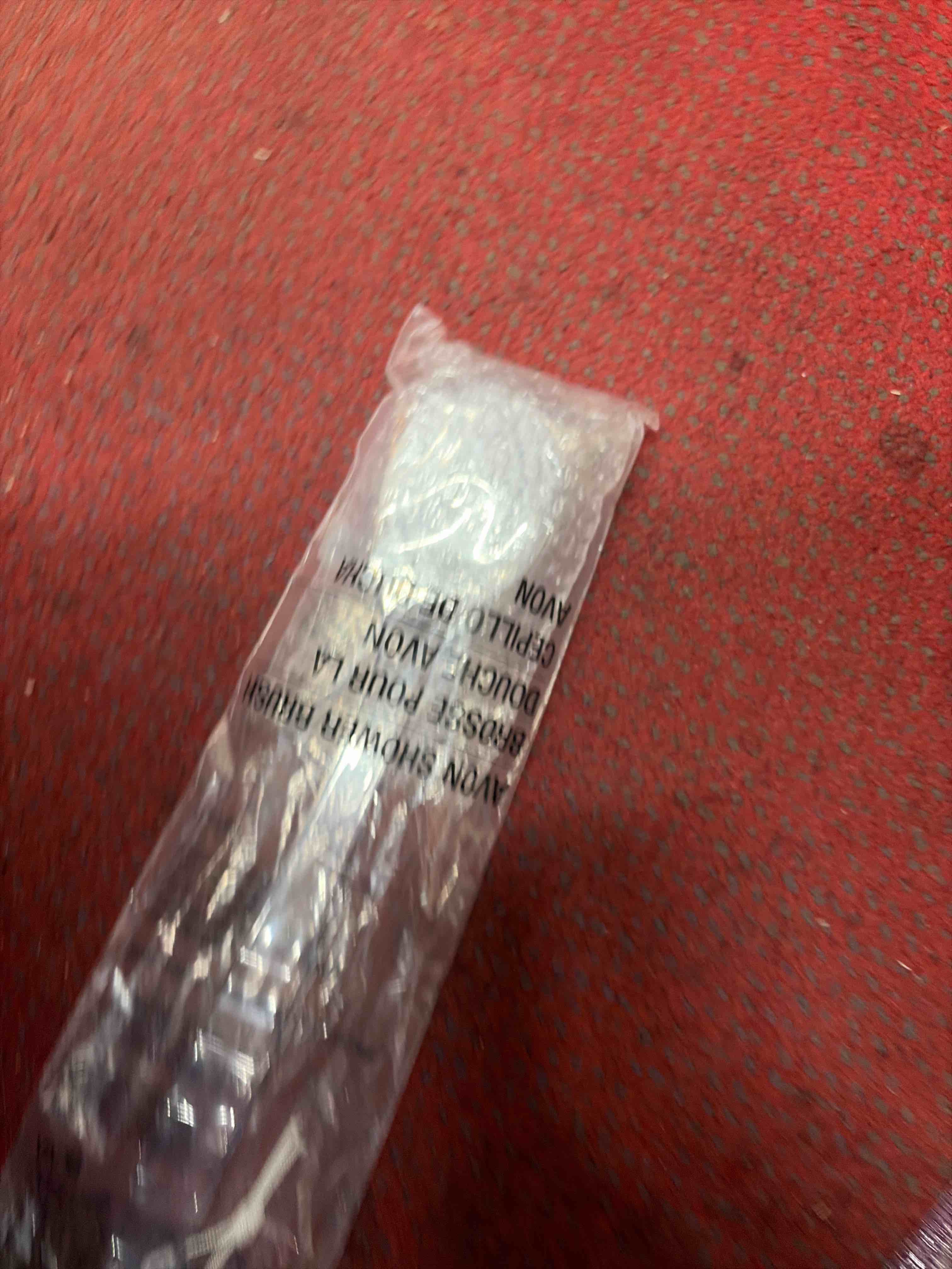 Condition photo showing New/Like New for Avon shower brush 