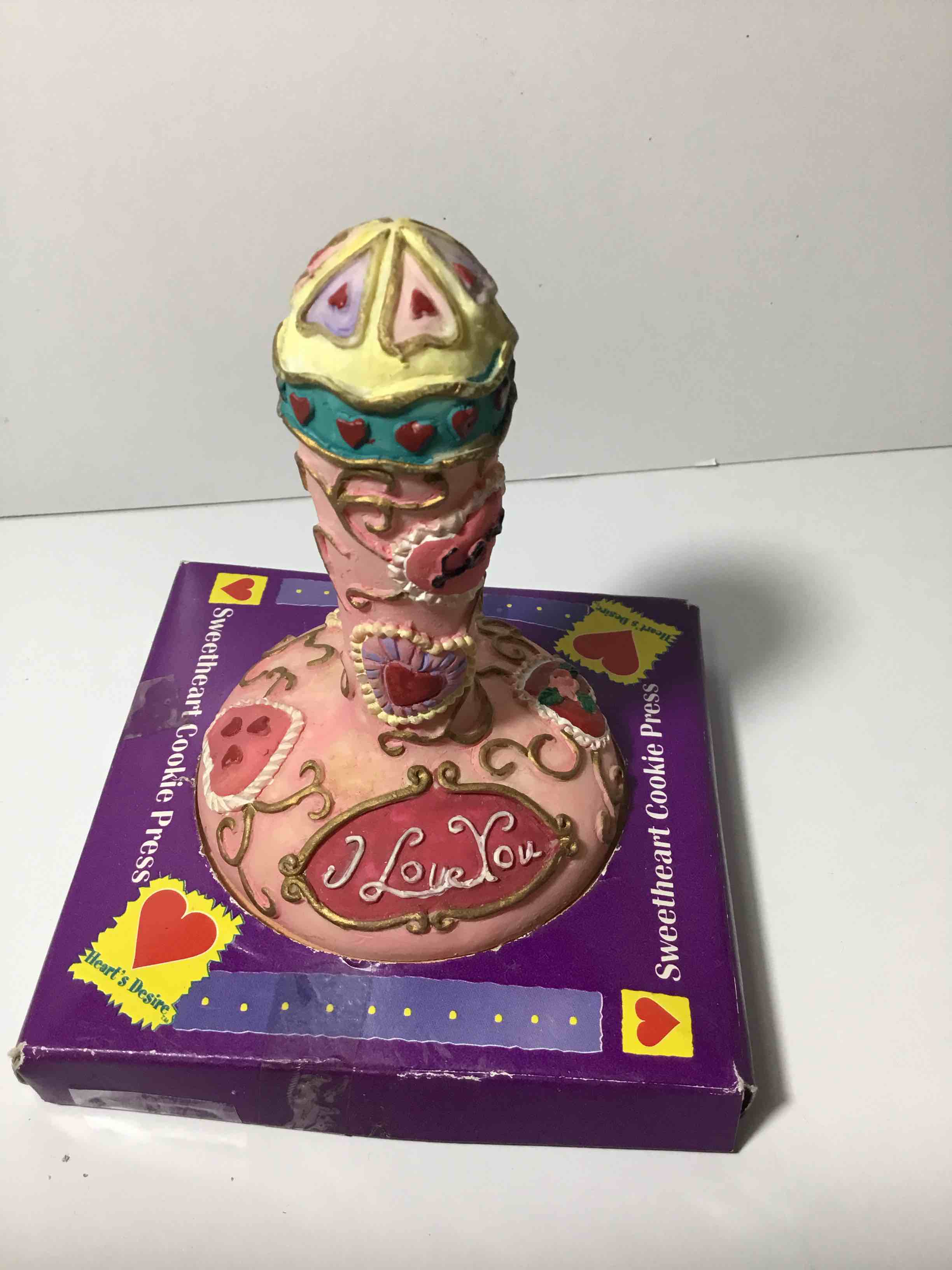 This is a "Sweetheart Cookie Press" with a "Heart's Desire" design 
