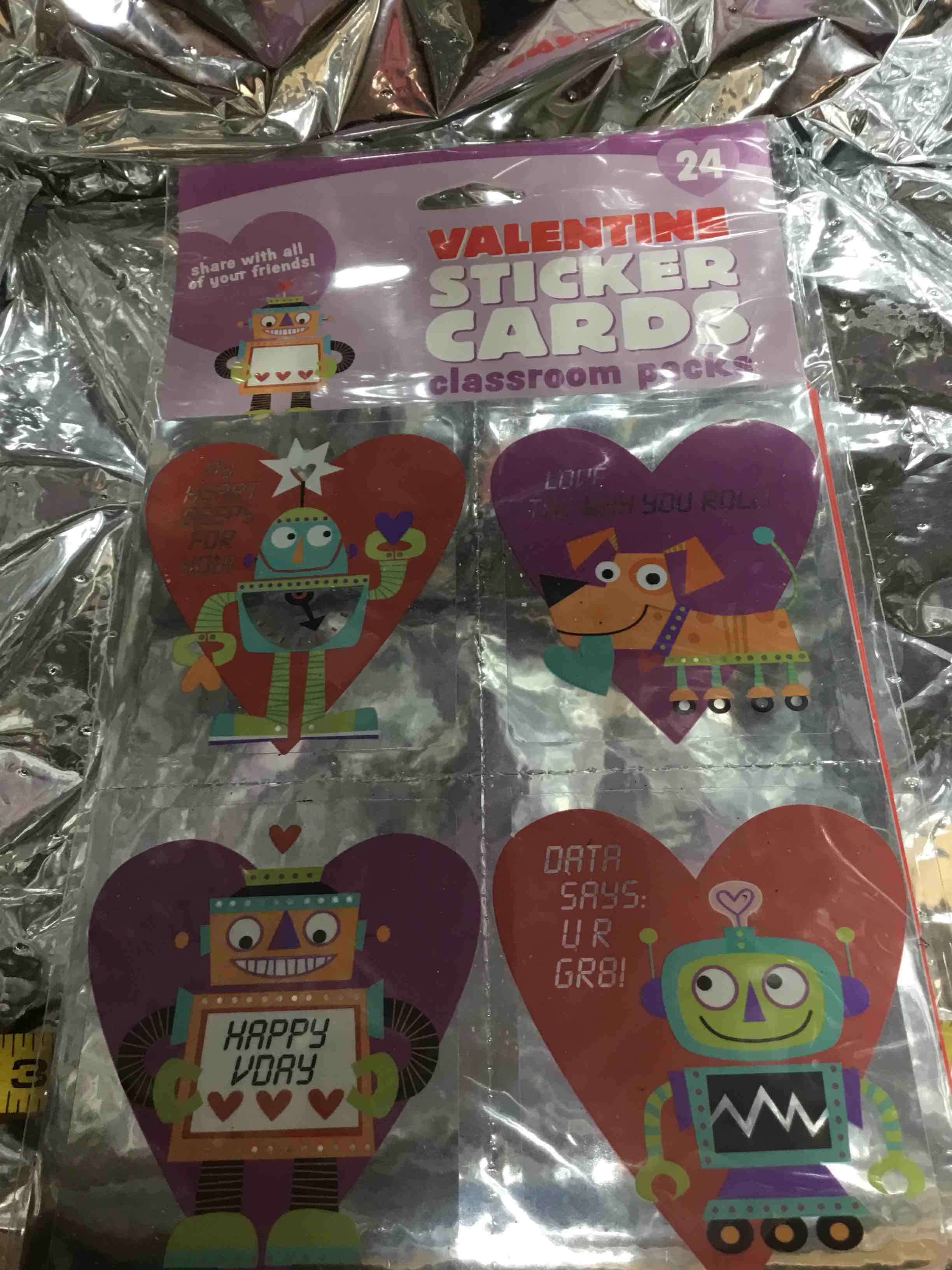 This is a pack of 24 Valentine Sticker Cards, designed for classroom use. The packaging features a robot and a dog, and the cards inside have cartoon designs.