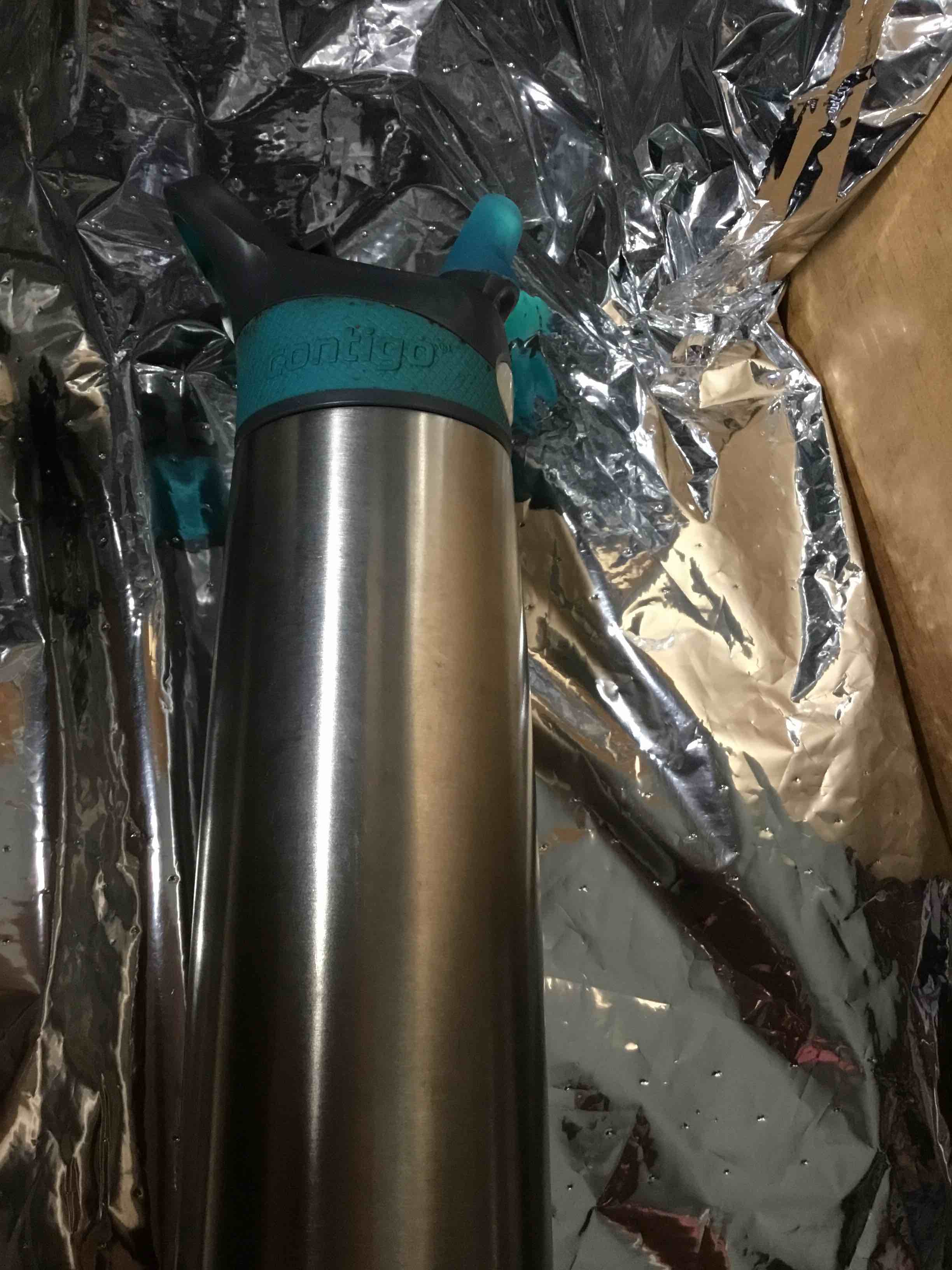 Contigo brand stainless steel water bottle. It appears to be a vacuum-insulated bottle, designed to keep drinks cold or hot for extended periods