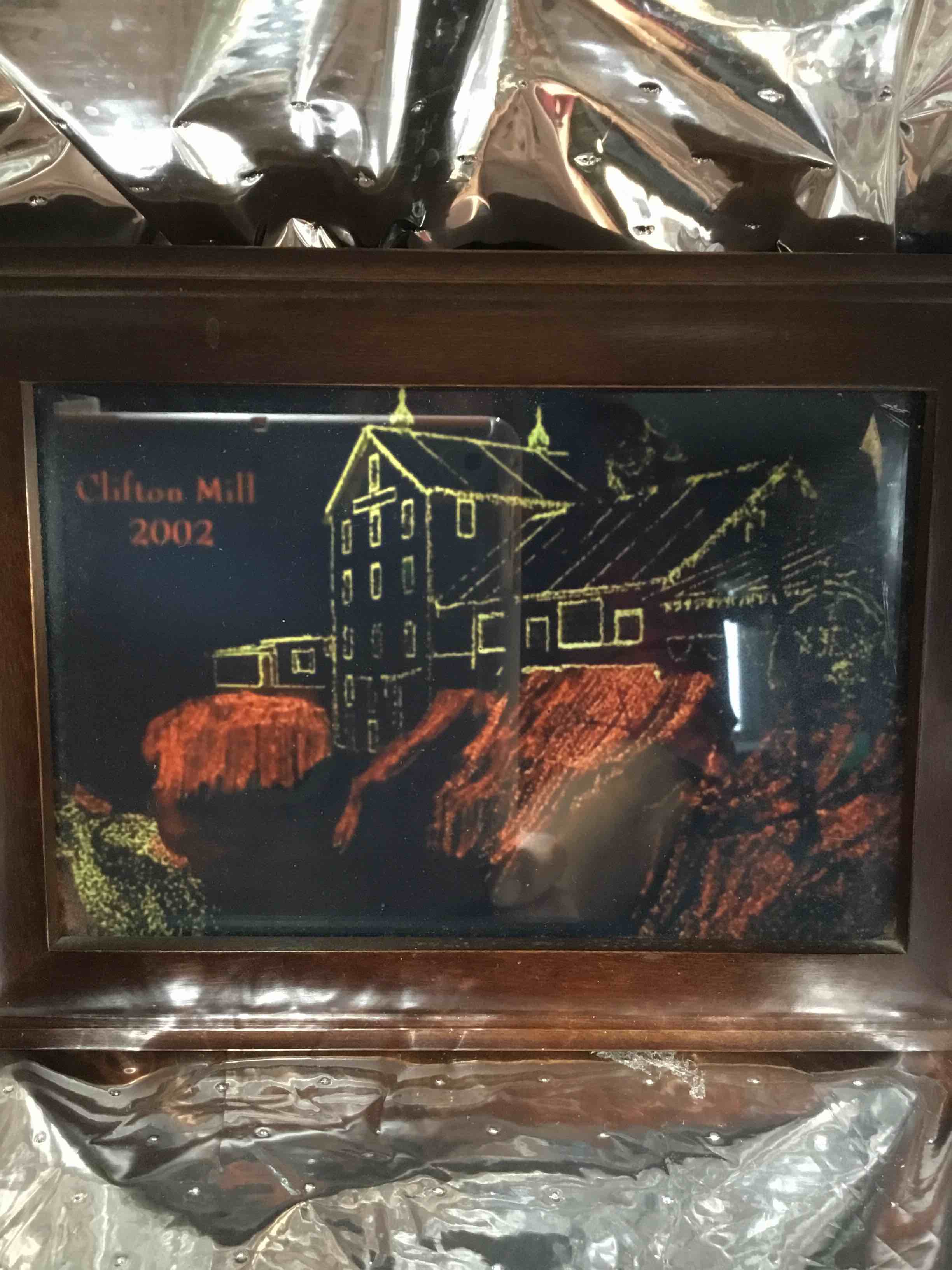 The image shows a piece of art depicting the Historic Clifton Mill, a water-powered grist mill located in Ohio.