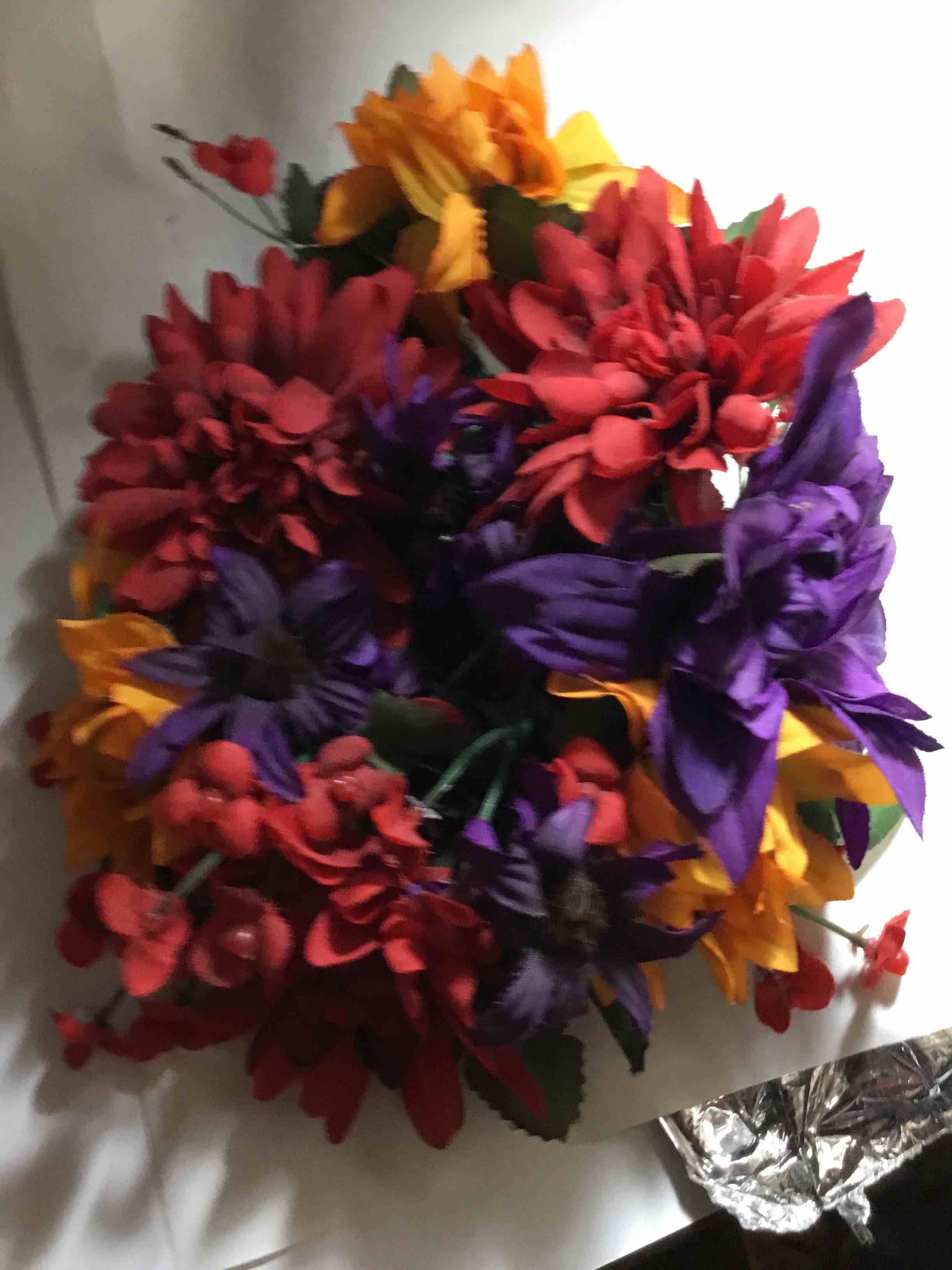 Floral wreath, which is a circular arrangement of flowers, leaves, or other materials