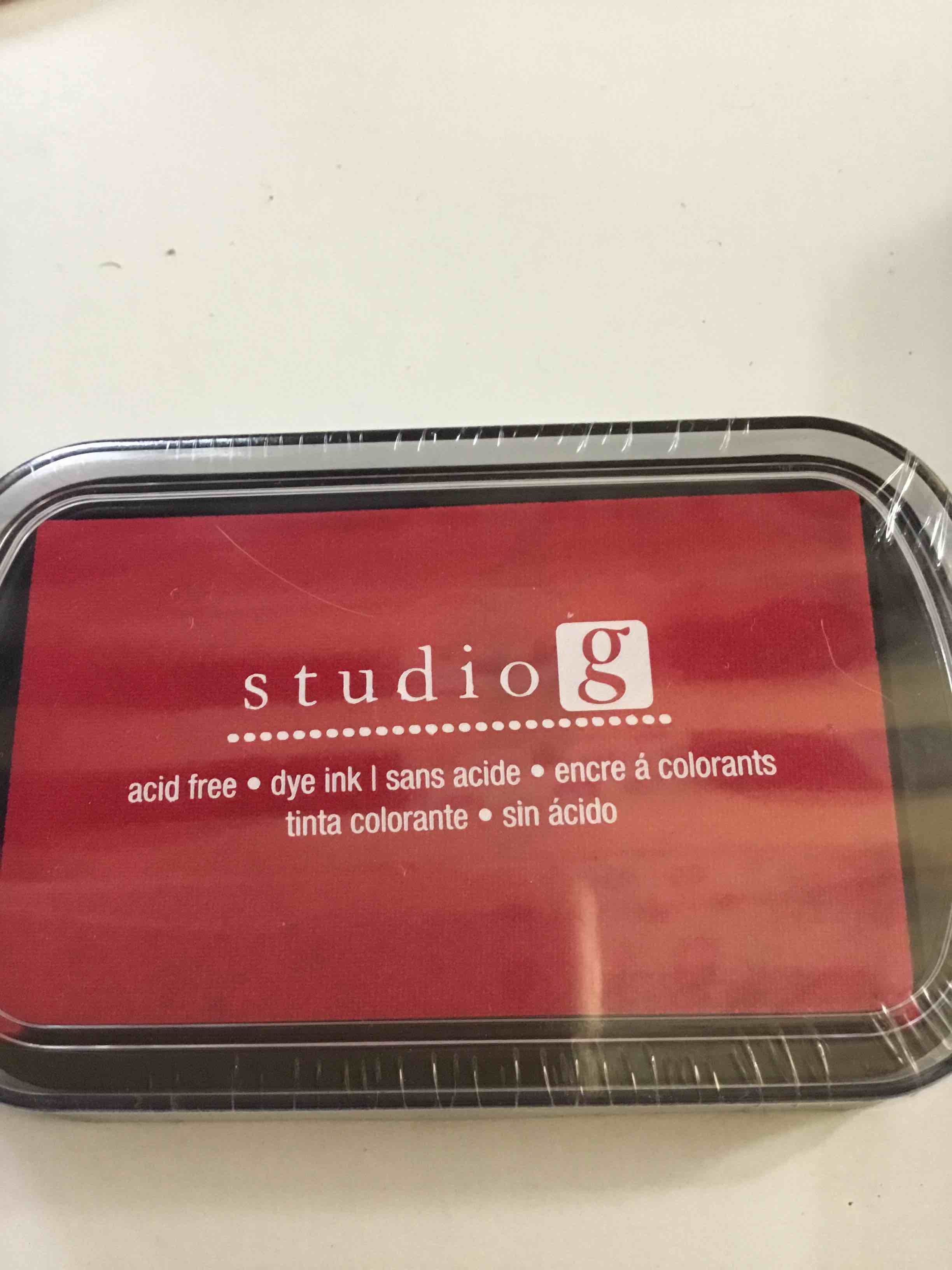 Studio G brand stamp pad. It is a red, acid-free dye ink pad used for crafting
