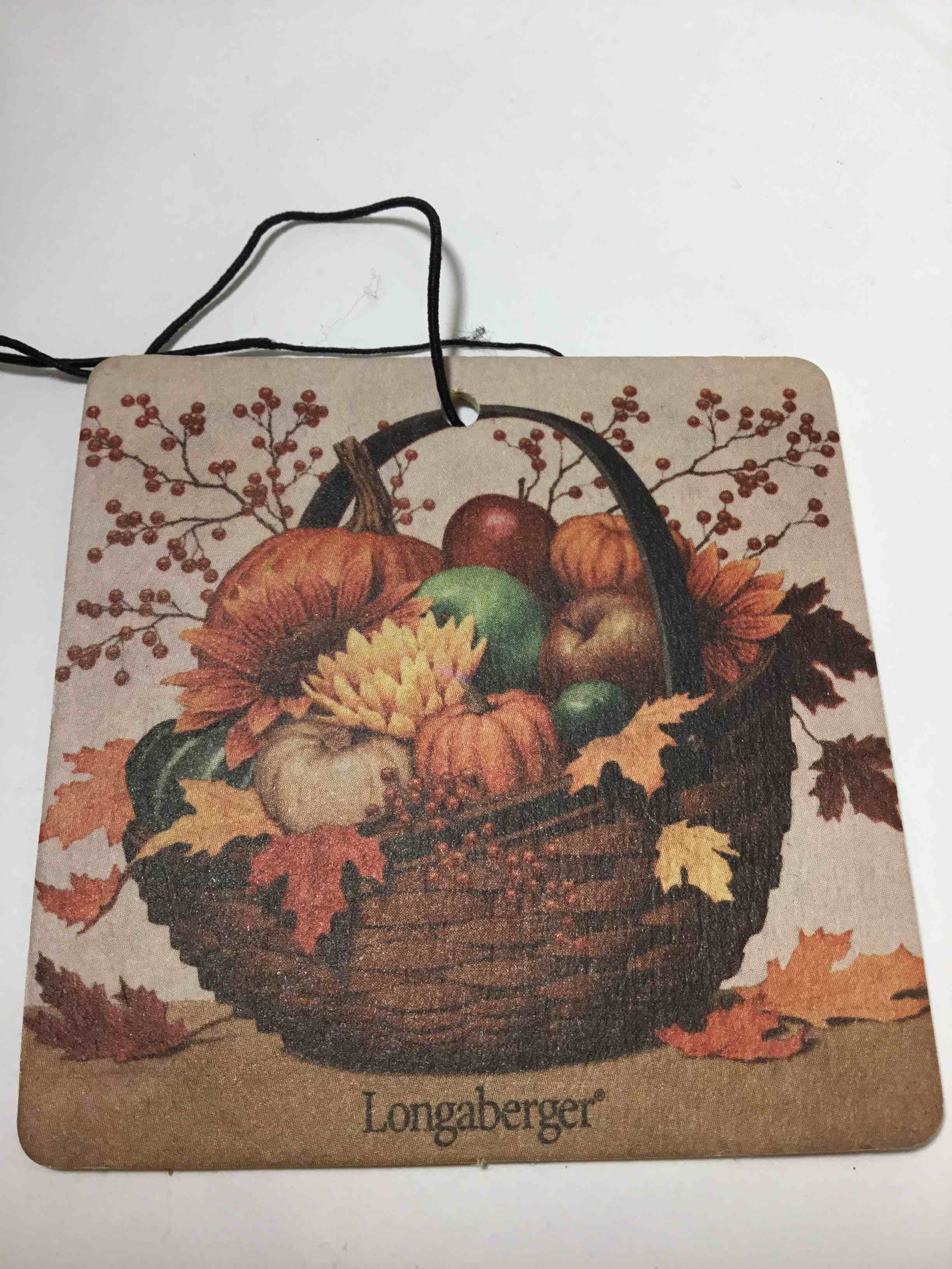 Longaberger decorative item hanging ornament, featuring a fall-themed basket of pumpkins and apples.