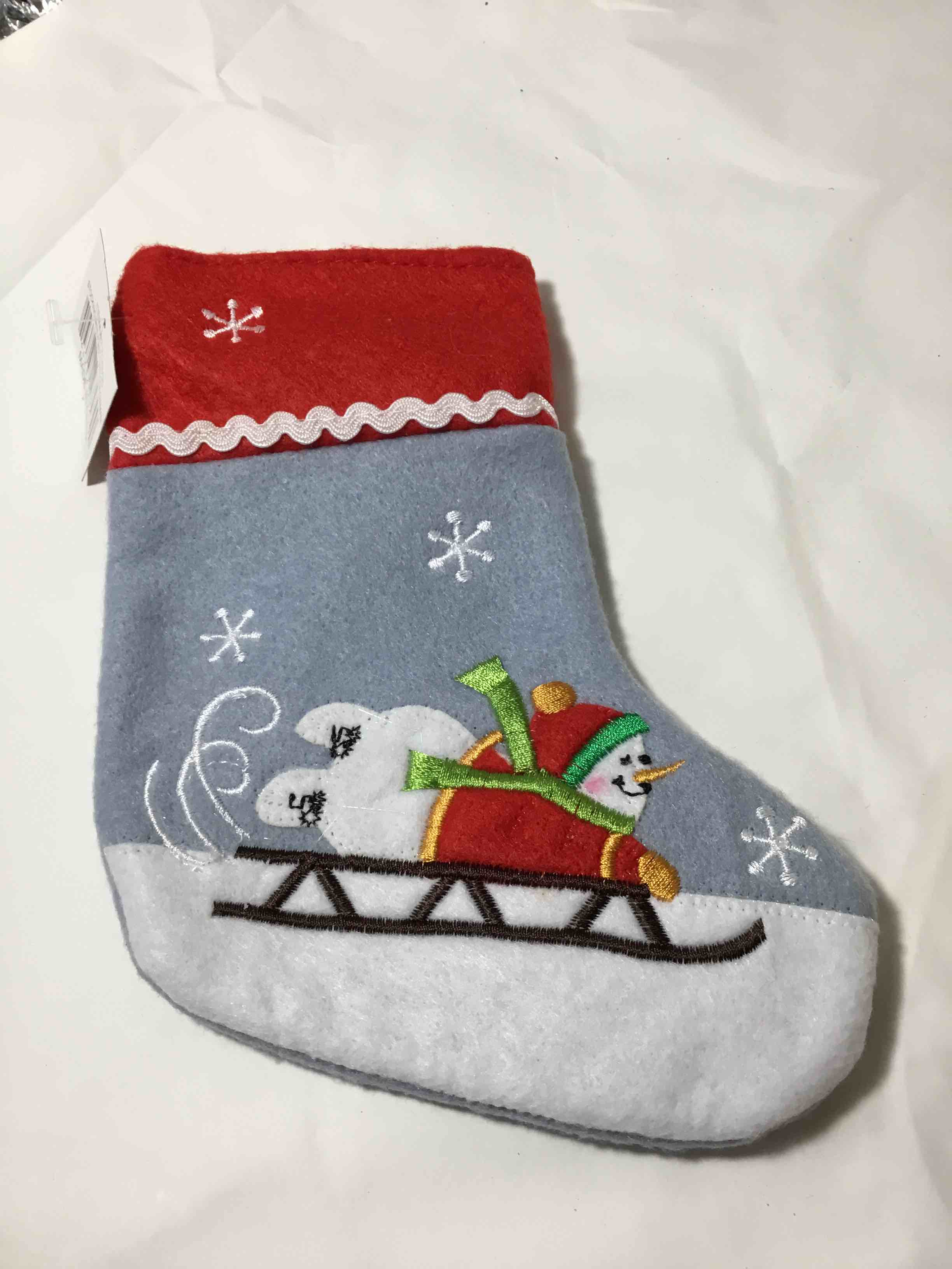 Christmas stocking featuring a snowman design 6”