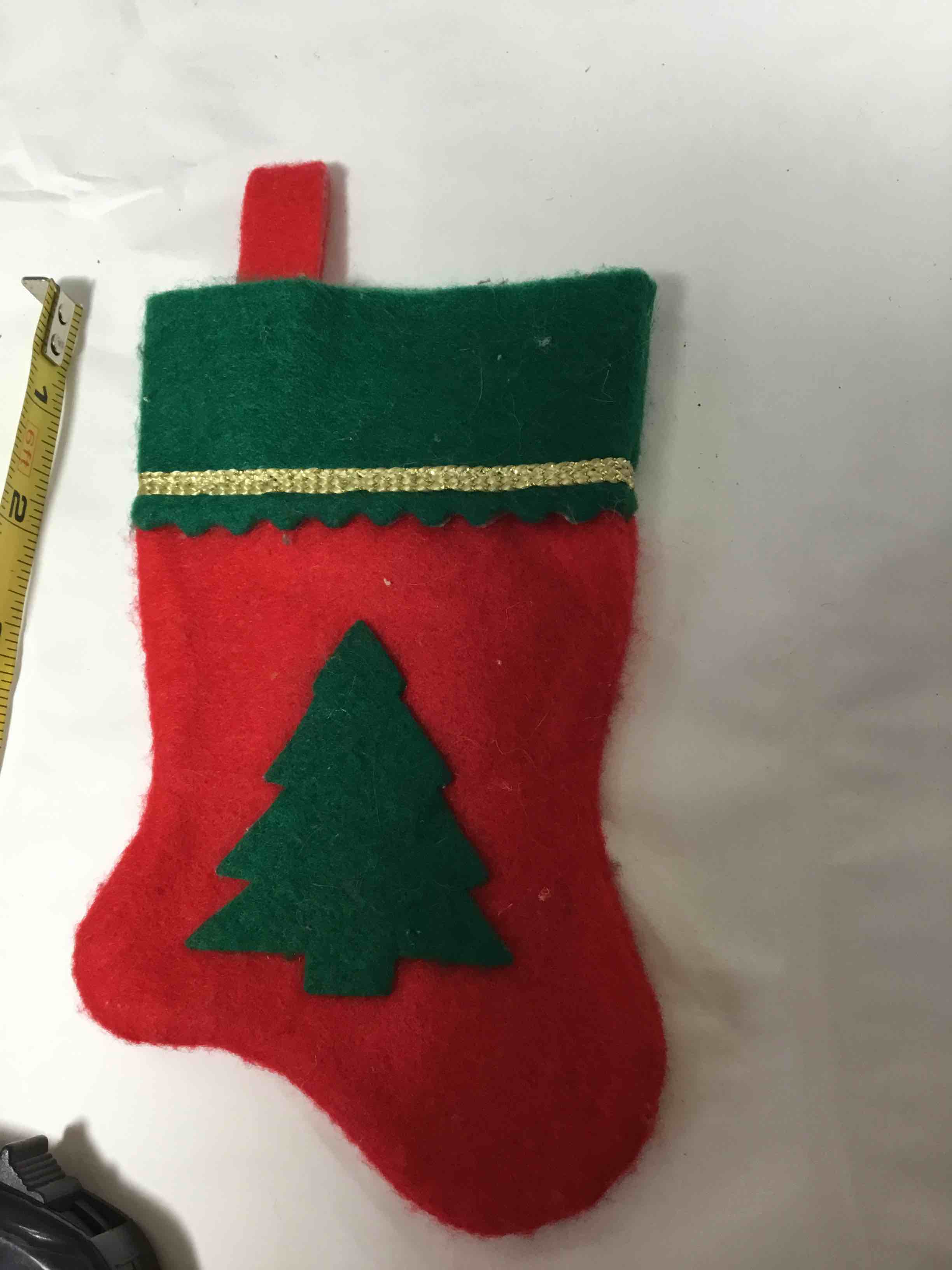 Christmas stocking featuring a tree design