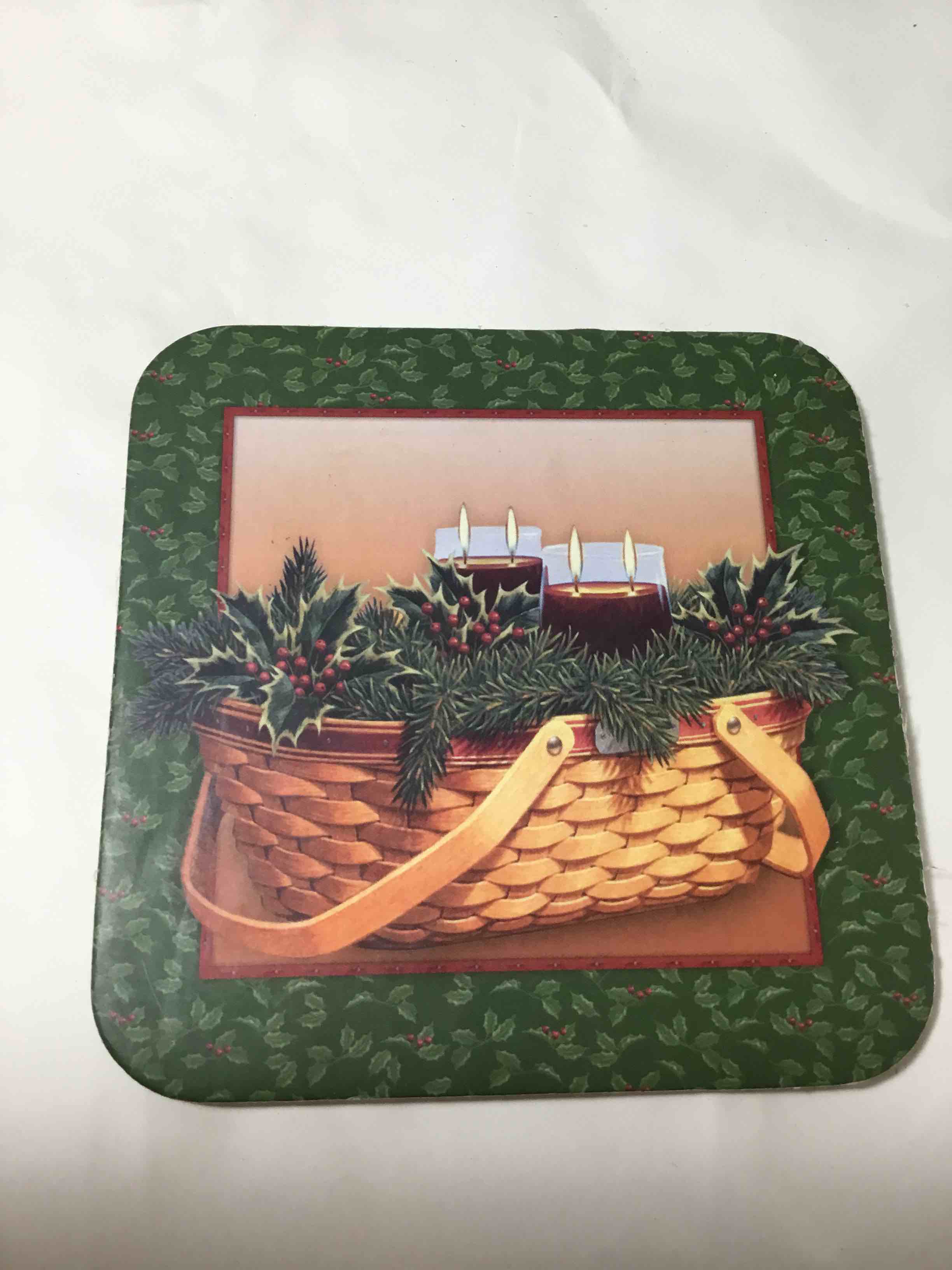 Longaberger Coaster featuring a Christmas basket and hollydesign
