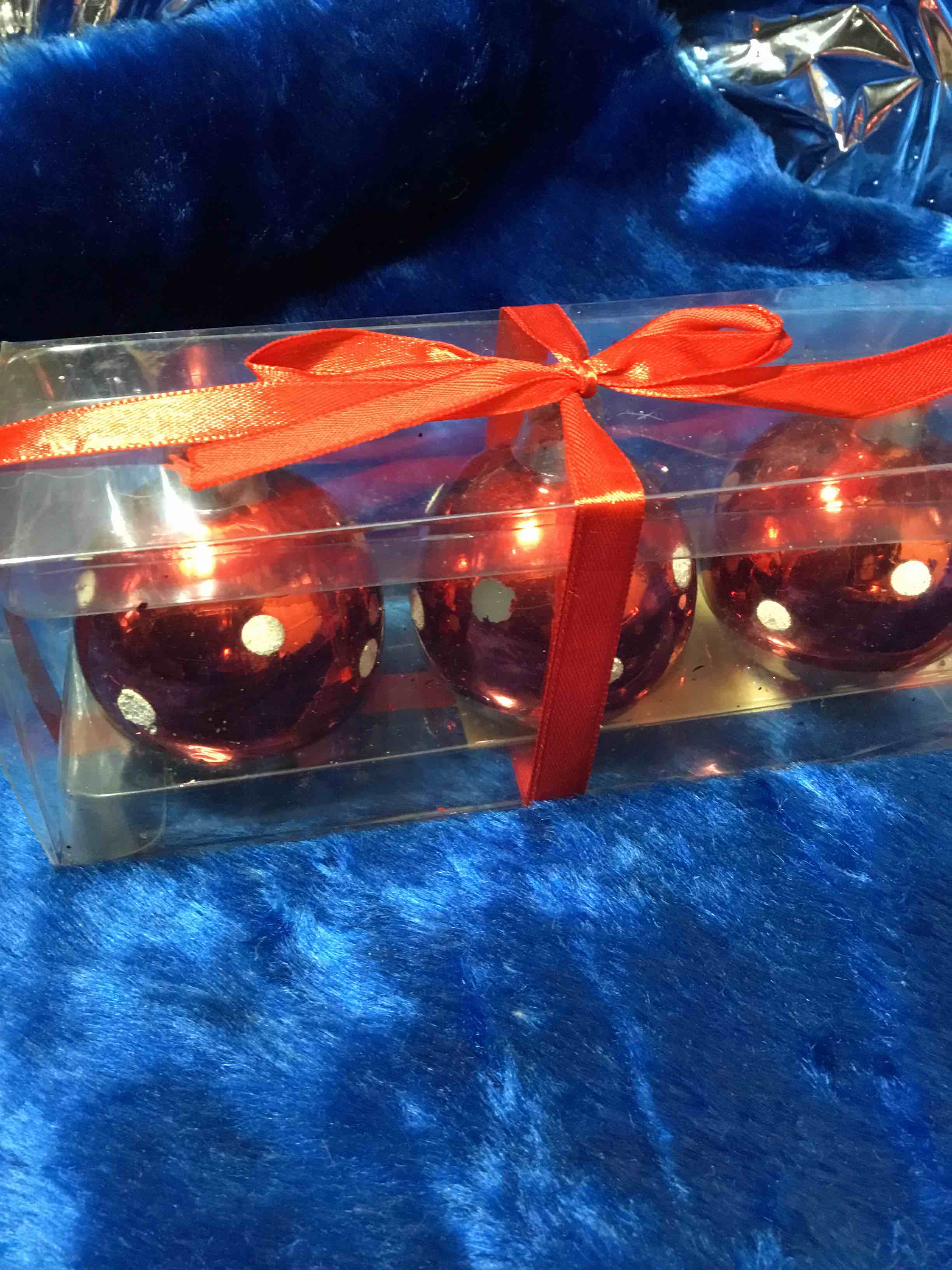 Set of three red ball, ornament, candles