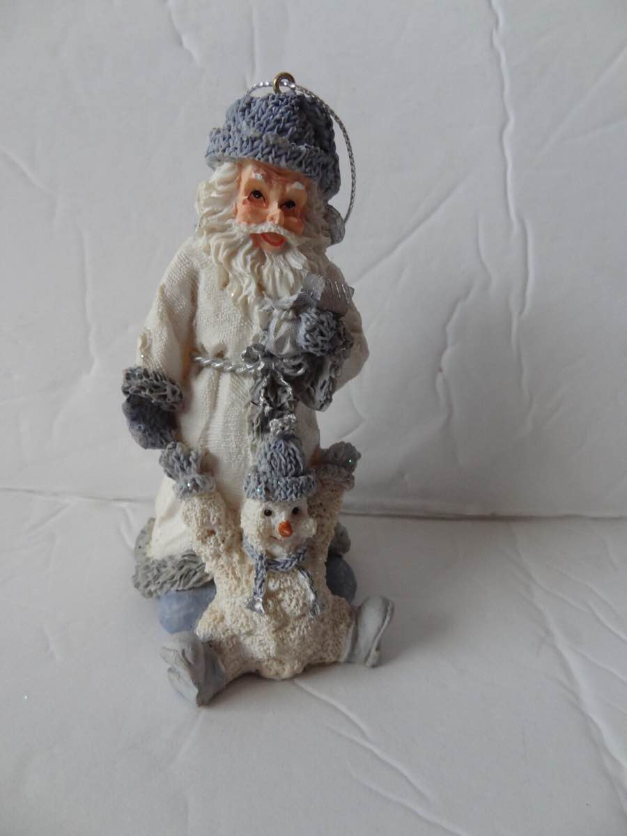 Encore Group, featuring Santa Claus  and a snowman buddy. This specific item is part of the "Snow Buddies" series