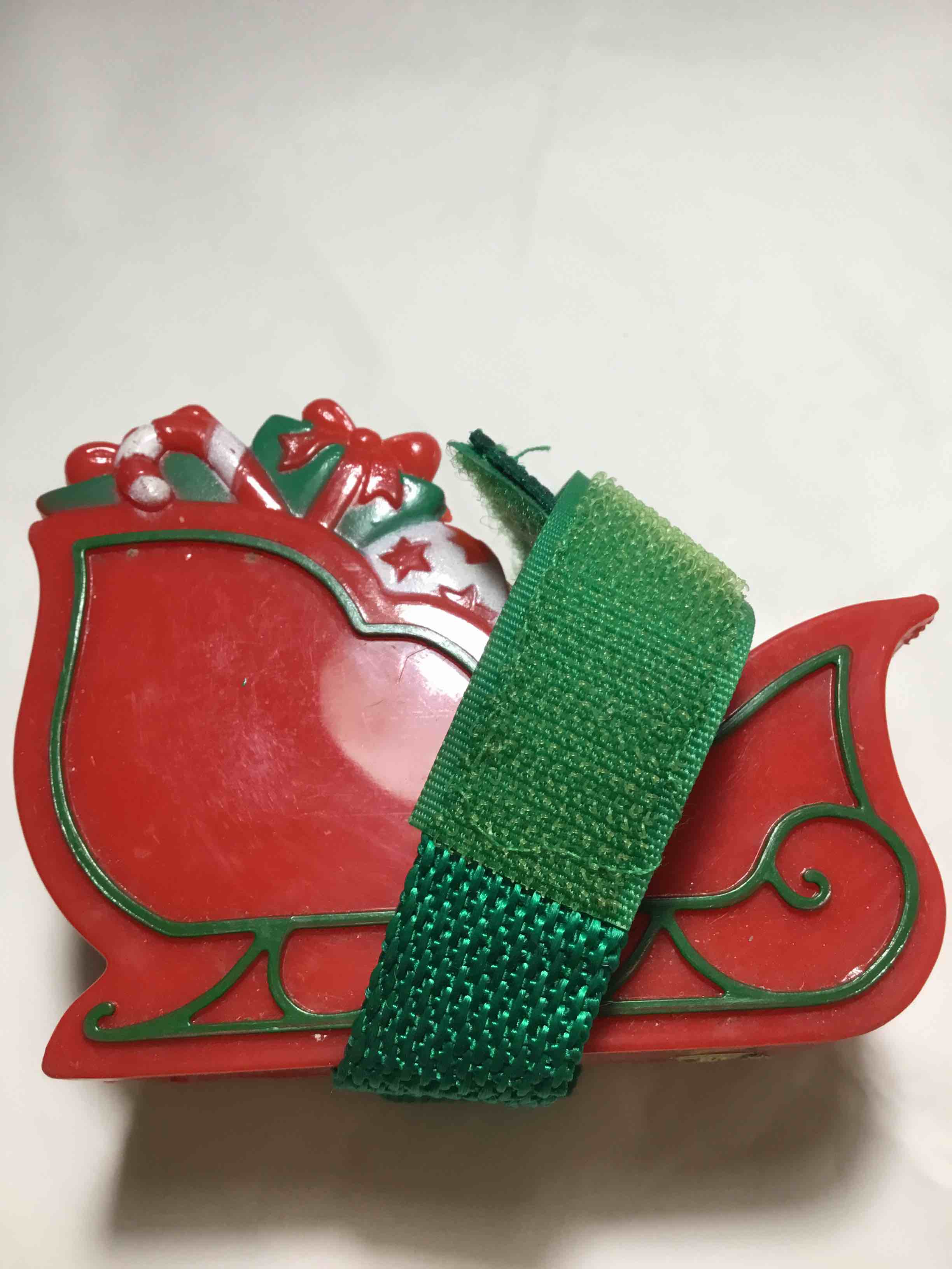Christmas-themed tape dispenser shaped like a red Santa sleigh