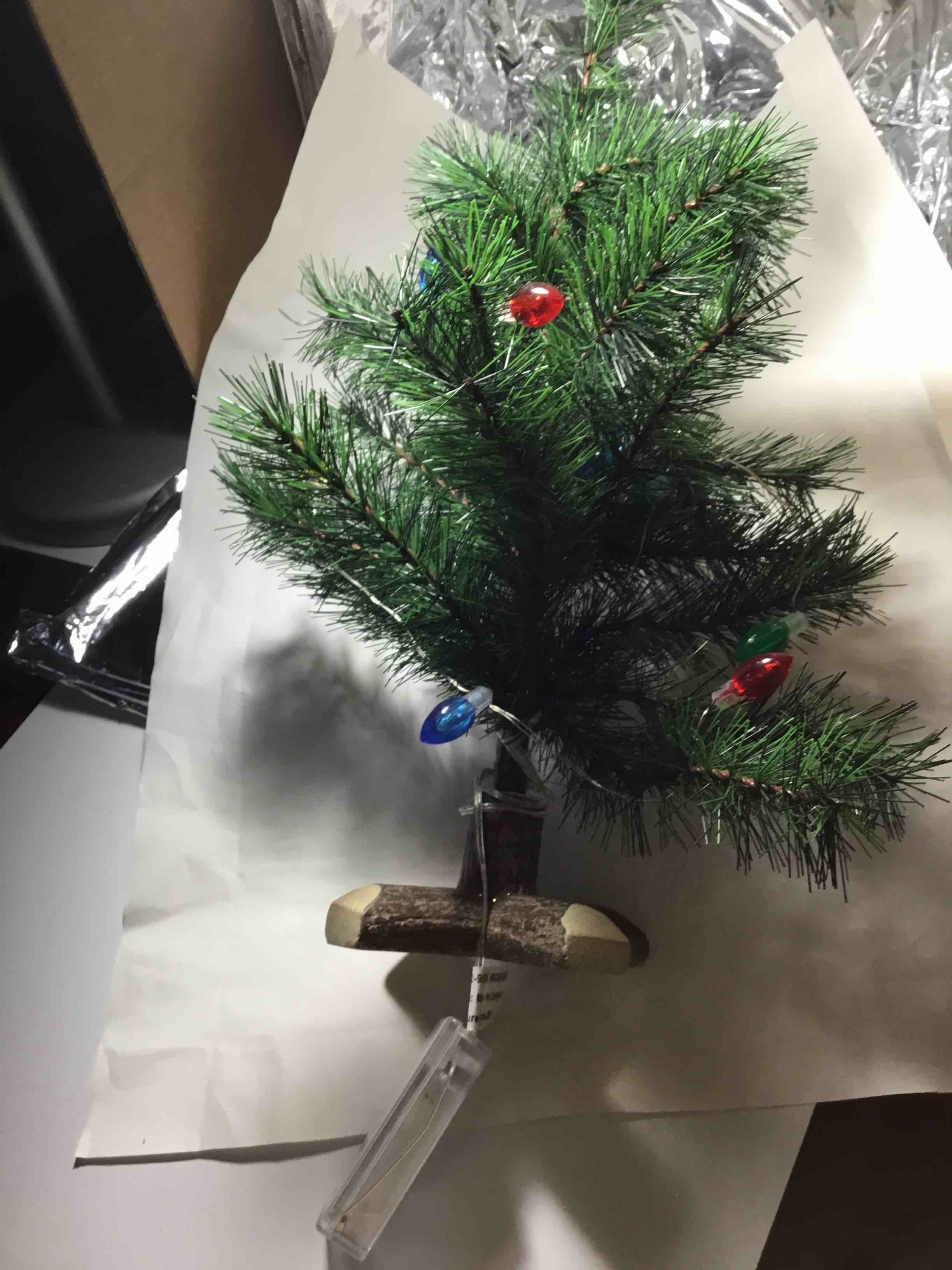 Small, pre-lit artificial Christmas tree