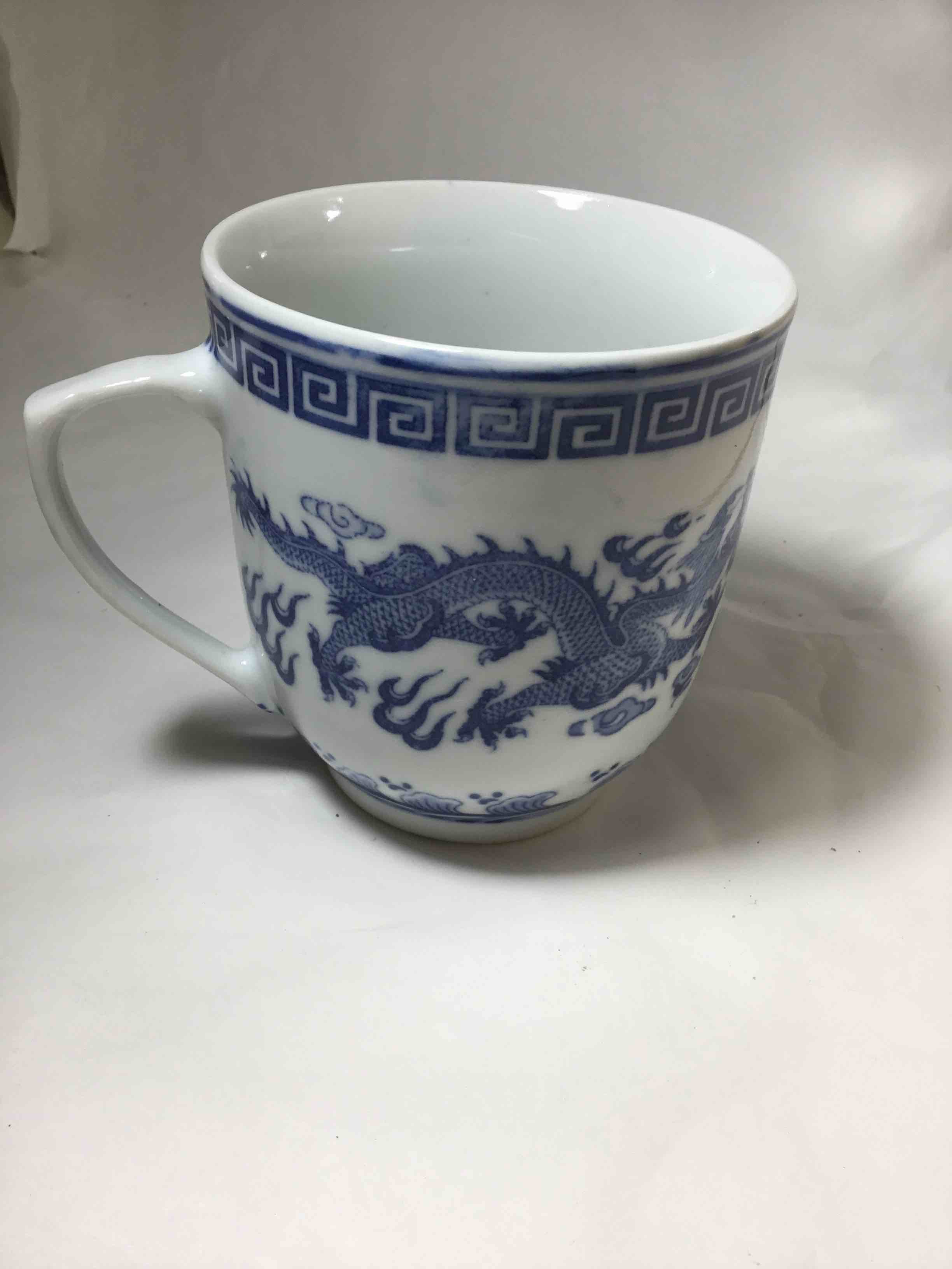 Chinese blue and white porcelain mug featuring a traditional dragon design