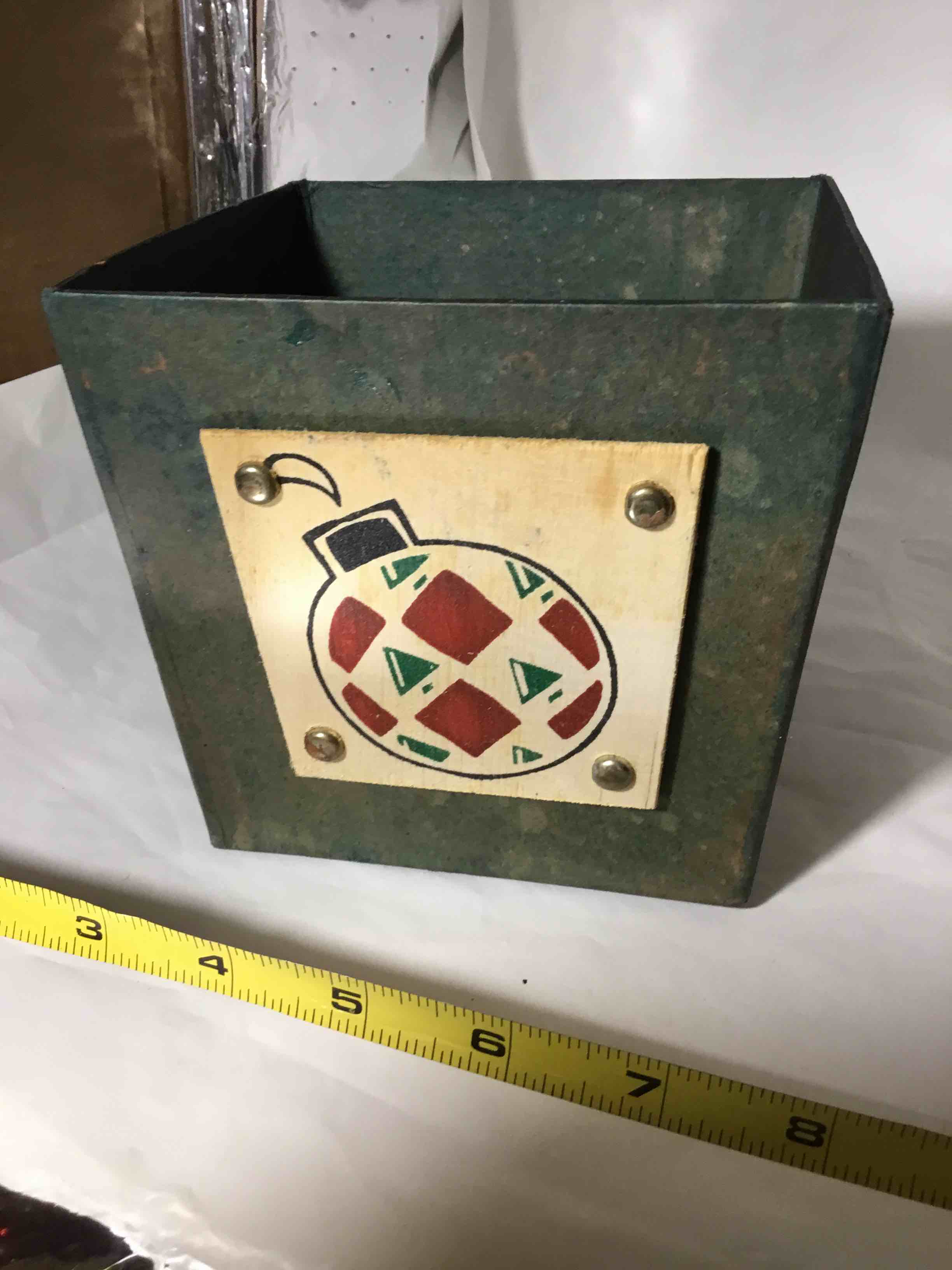 Composite material container Christmas ornament on front