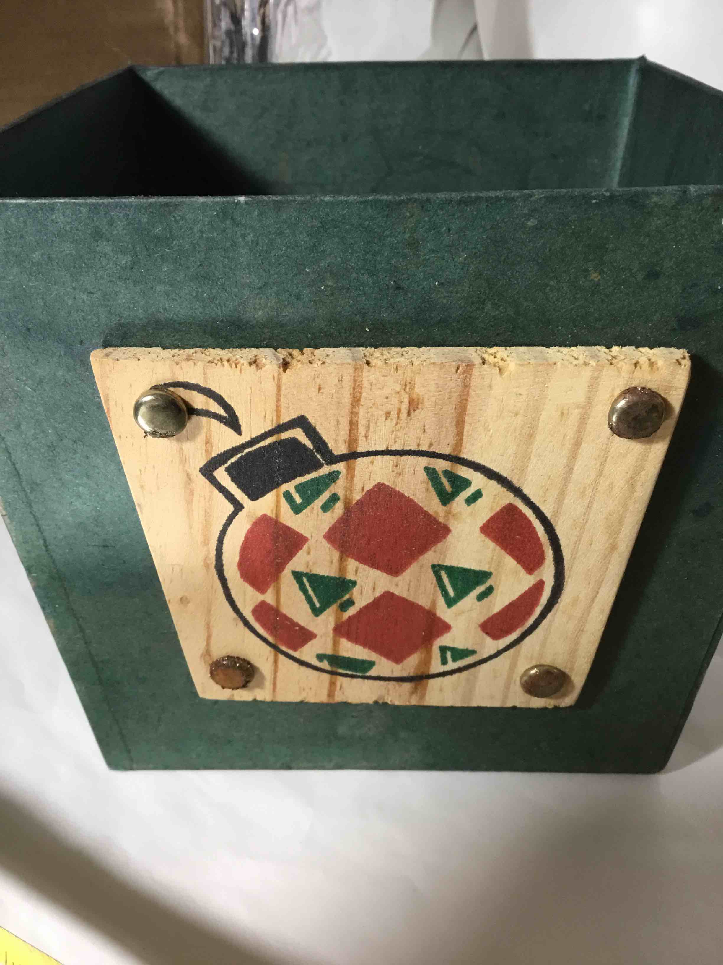 Composite material container Christmas ornament on front