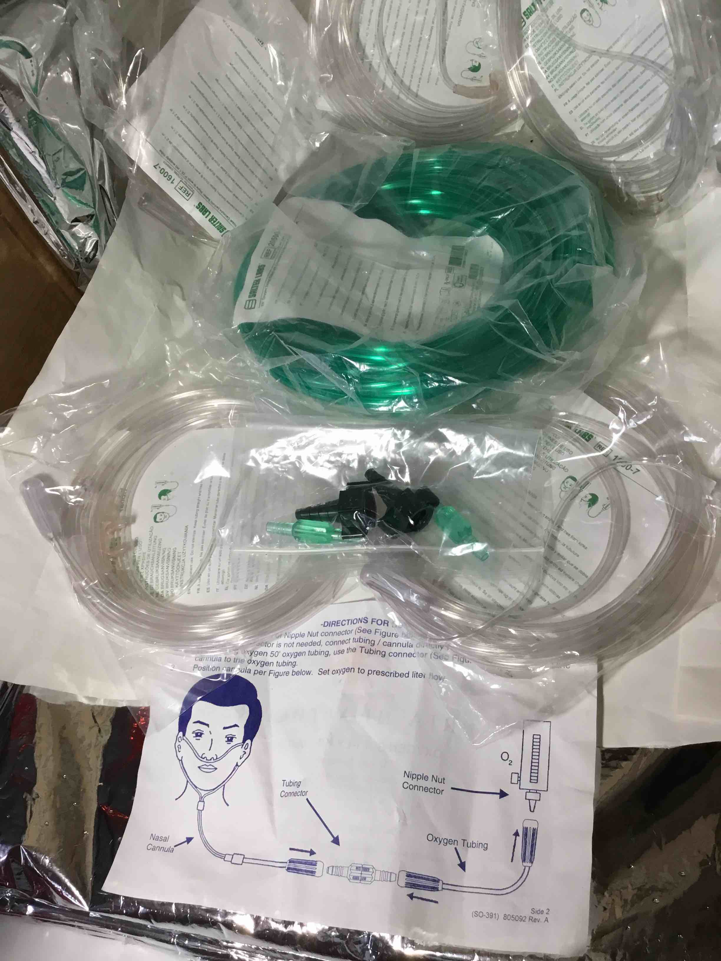 Parts of a oxygen supply kit, which includes oxygen tubing and connectors for use in respiratory therapy