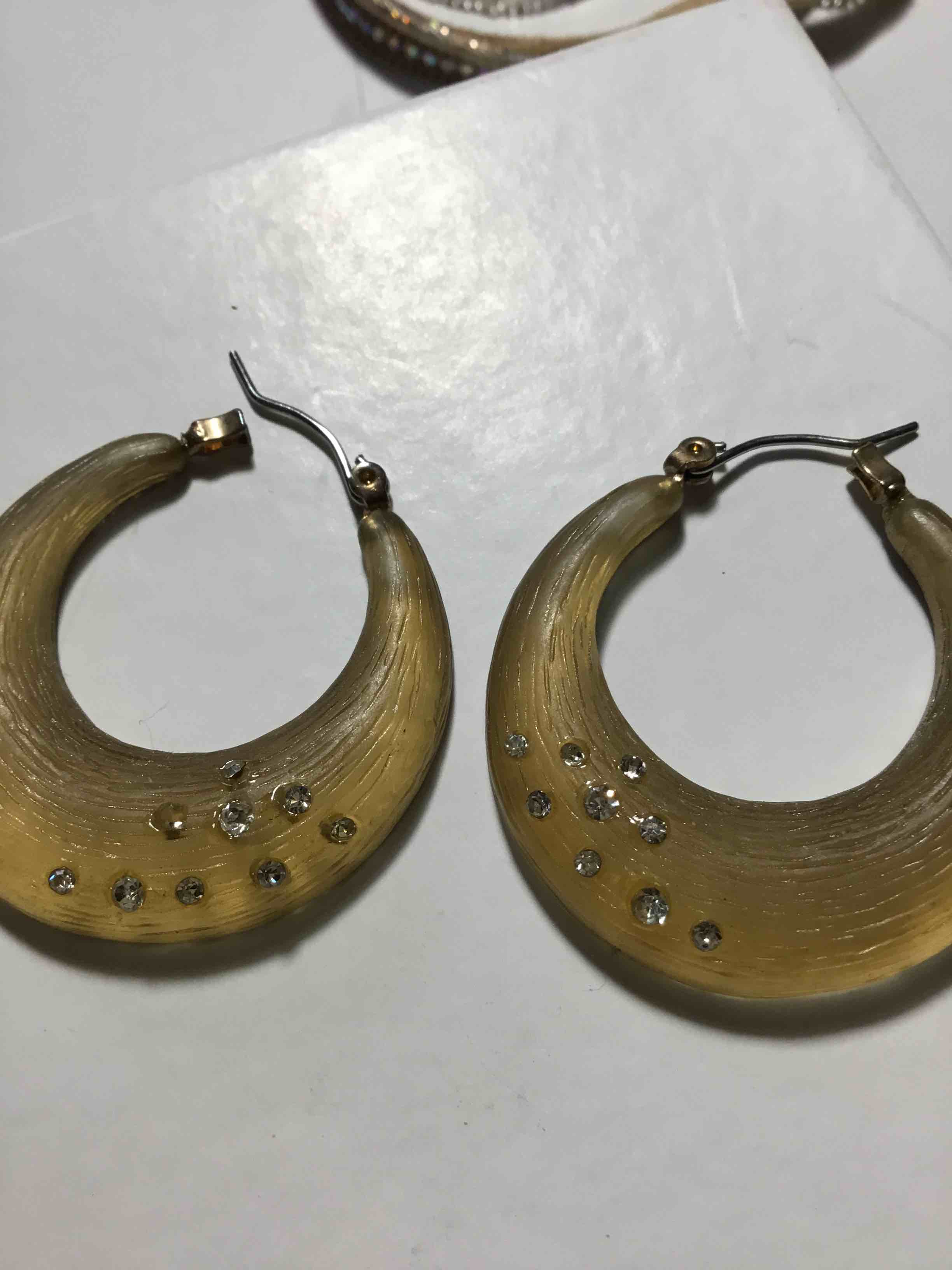 Frosted acrylic hoop earrings with crystal embellishments and metal earring wires