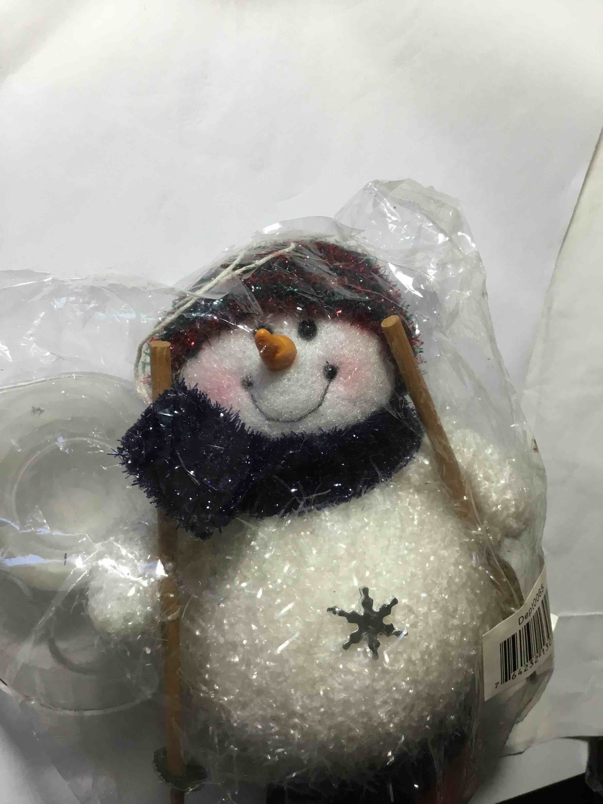 Christmas snowman figurine on skis