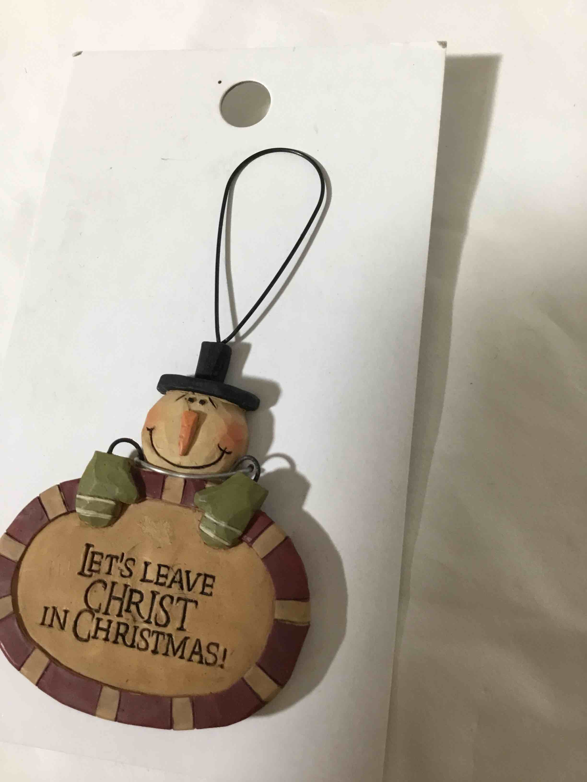 Blossom Bucket wooden snowman Christmas ornament with the text, "Let's Leave Christ in Christmas!".
