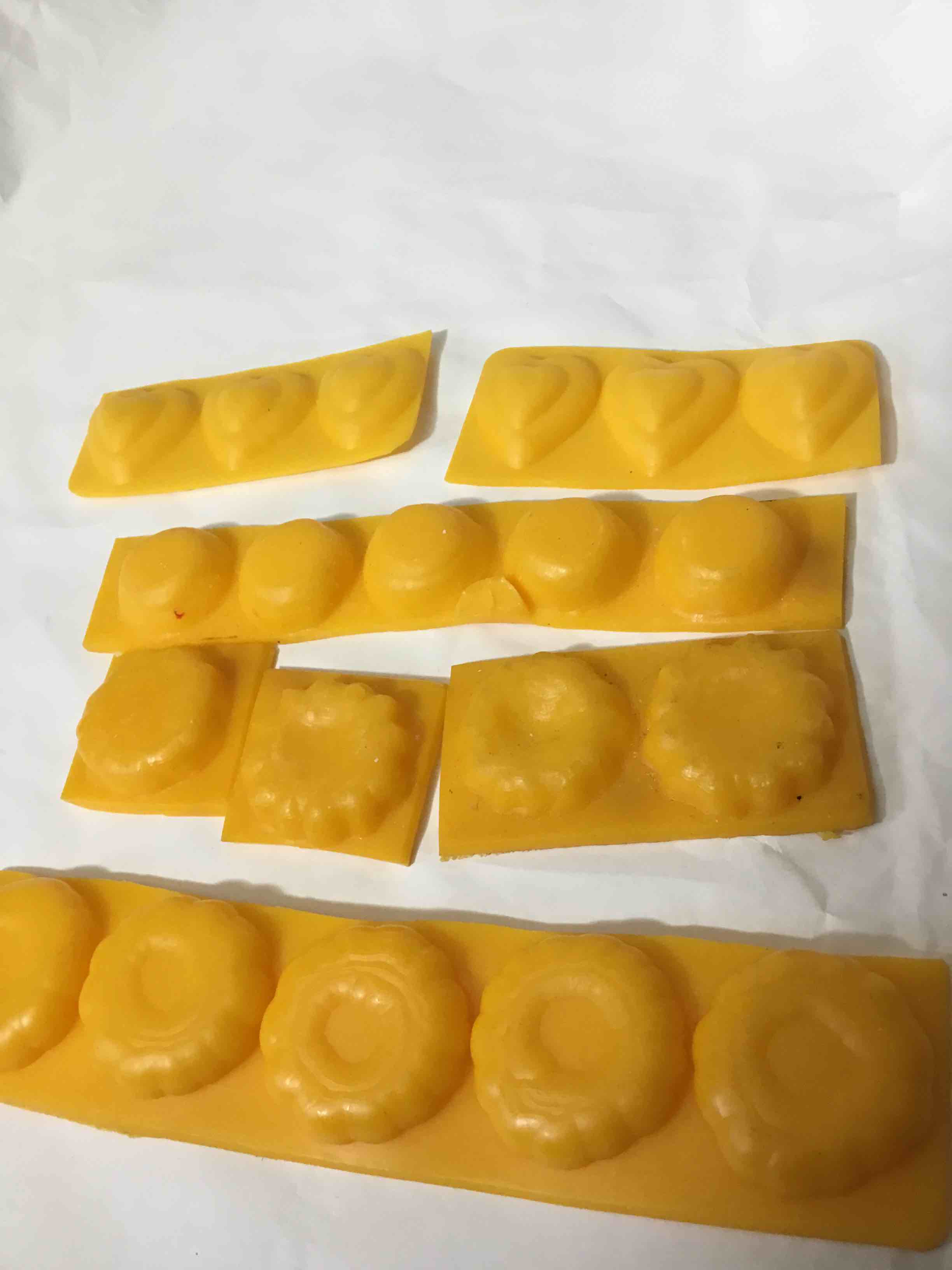 Condition photo showing As Is for Food molds feature different shapes, including hearts and rounded shapes