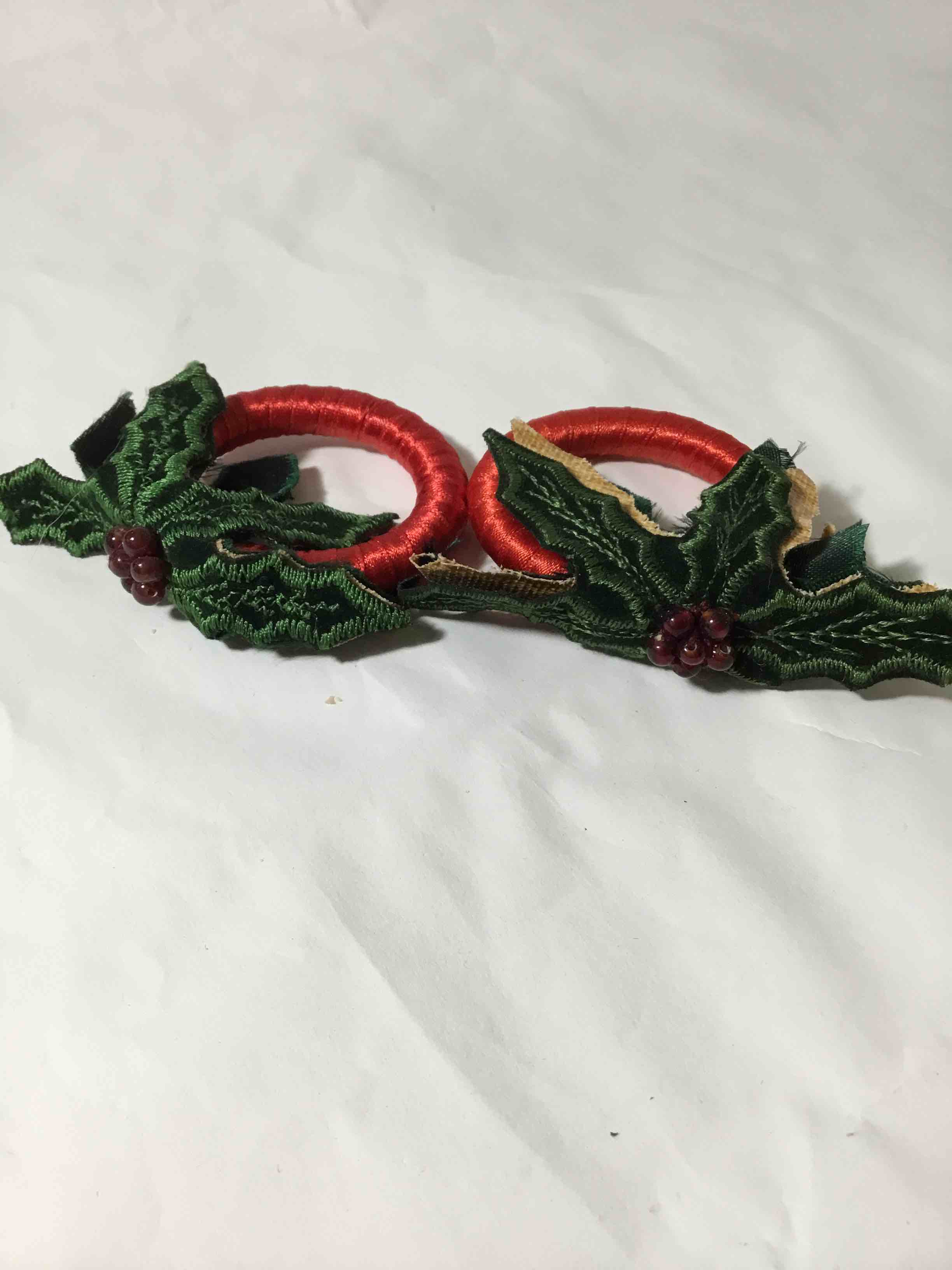 Condition photo showing As Is for Set of 2 Mistletoe napkin, rings