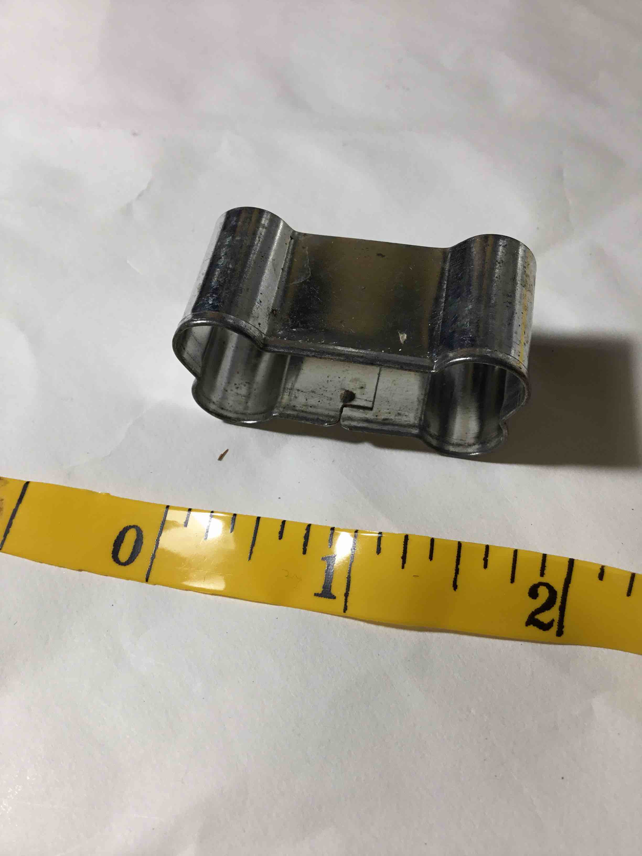 Condition photo showing As Is for Tiny metal dog bone cookie cutter. 