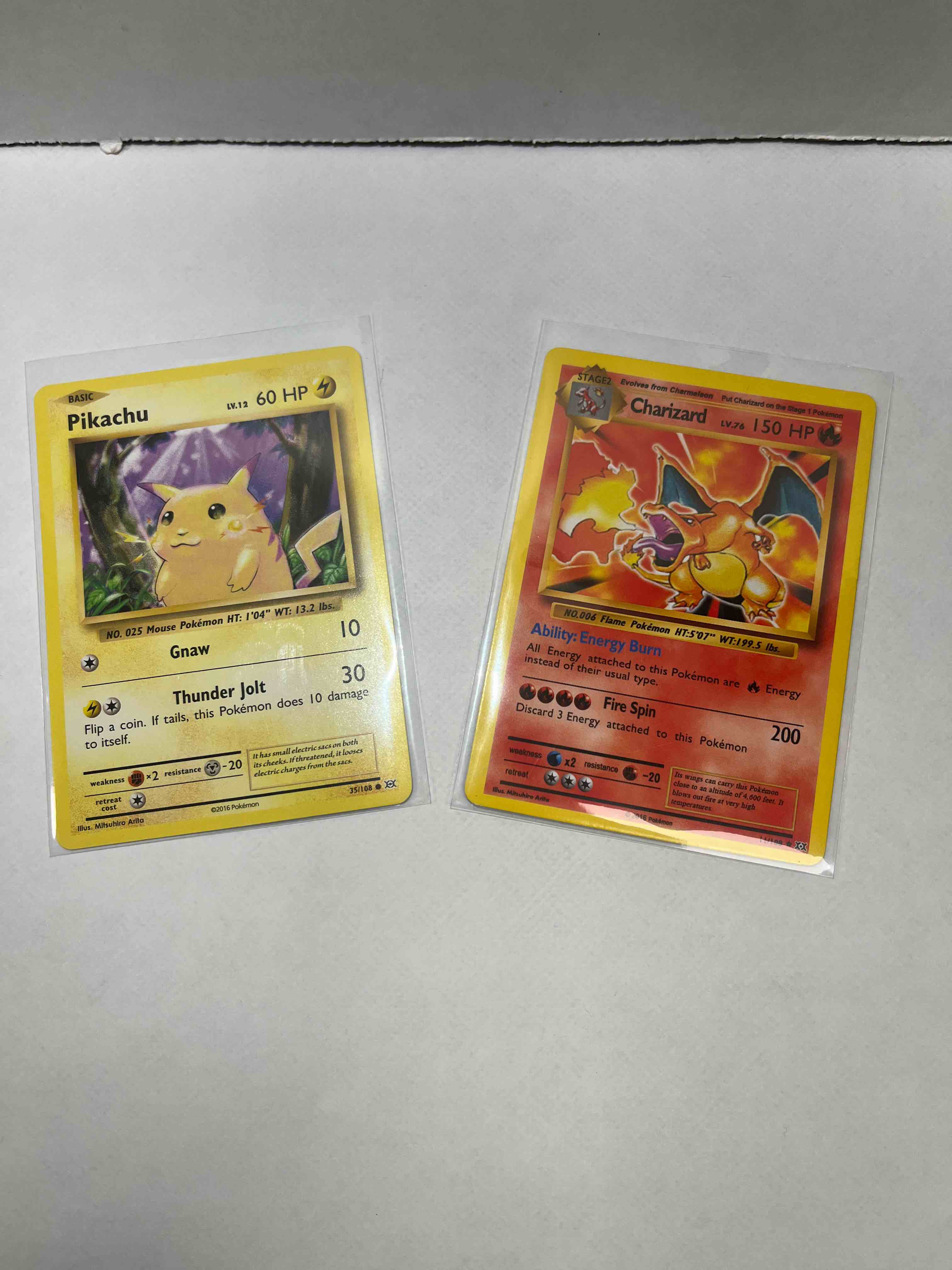 2016 pokémon pikachu 35/108 and charizard 11/108 cards! check these out!