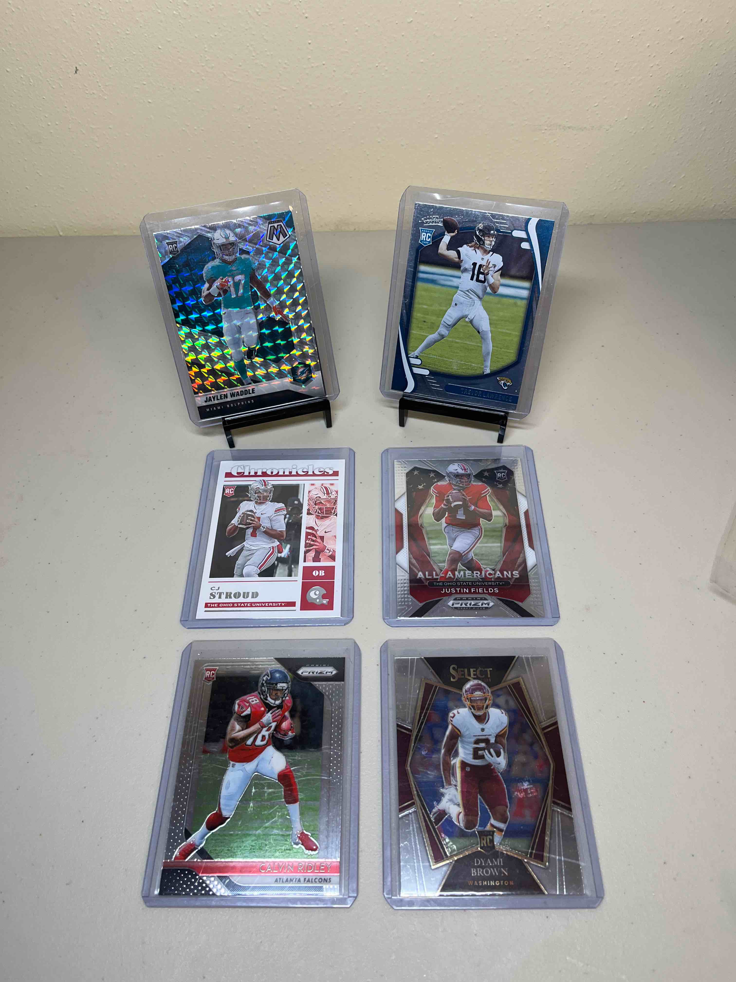 (6) Modern Football Rookie Cards- Trevor Lawrence, Jaylen Waddle, CJ Stroud, Justin Fields, Calvin Ridley, and Dyami Brown! Panini Prizm, Select, Absolute, and Mosaic!!