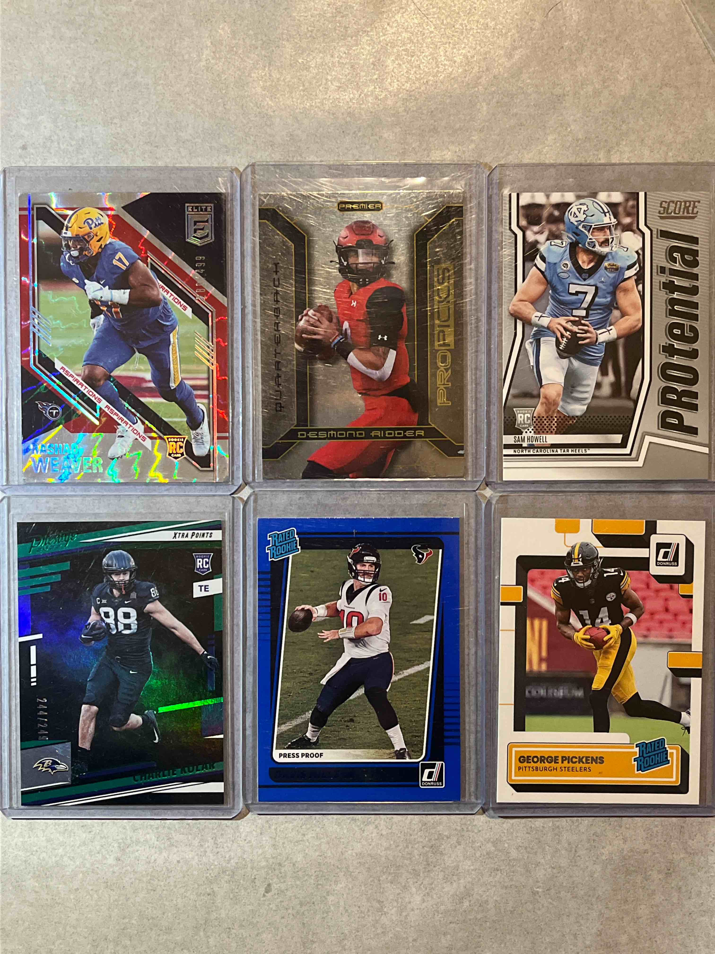 (6) Card lot Modern Football Cards- Rookie Parallels & Serial #d Cards!! Panini Donruss Elite, Prestige & Score Football! Donruss Rated Rookie George Pickens & more!!