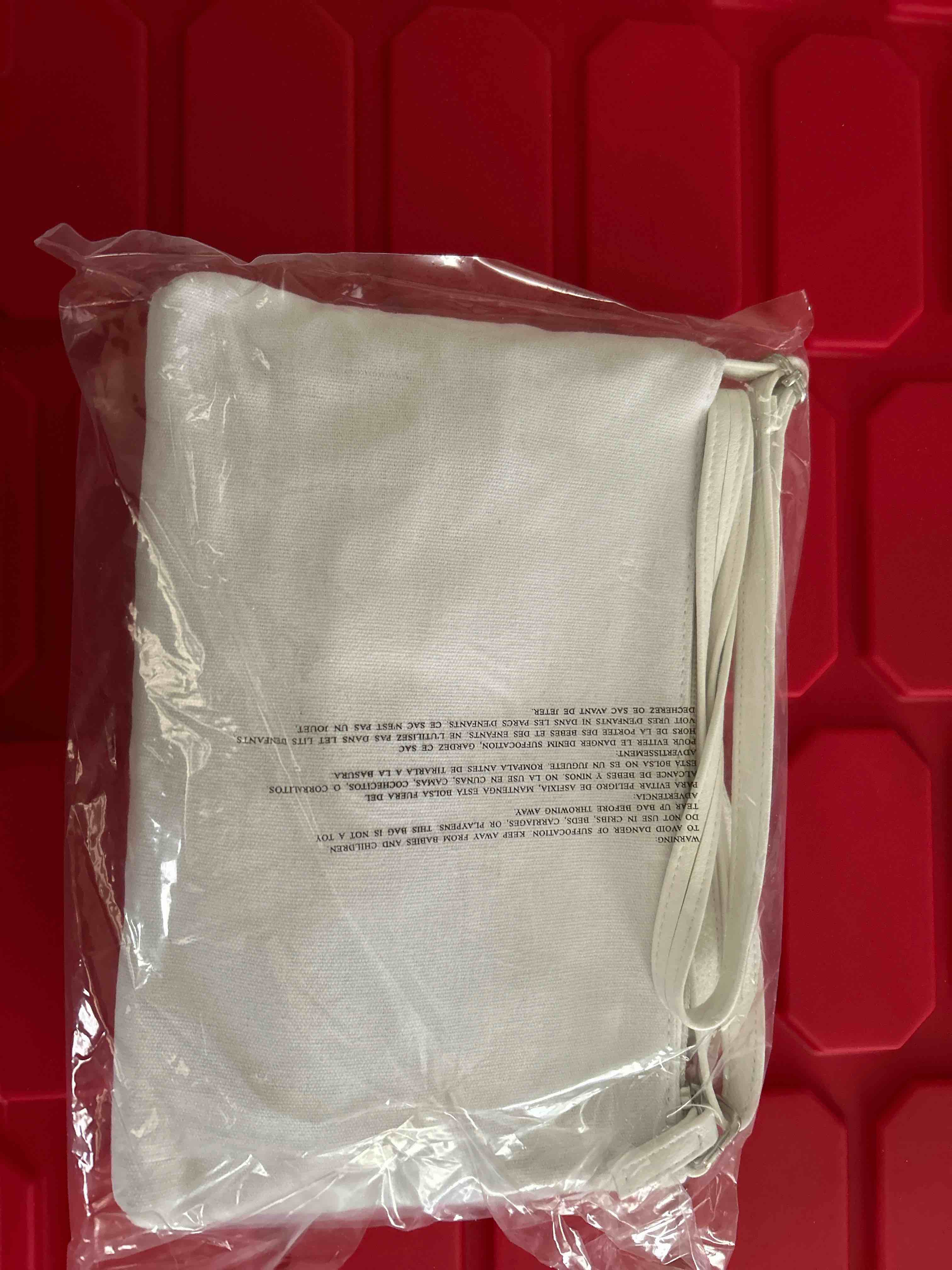 Condition photo showing item condition for white purse
