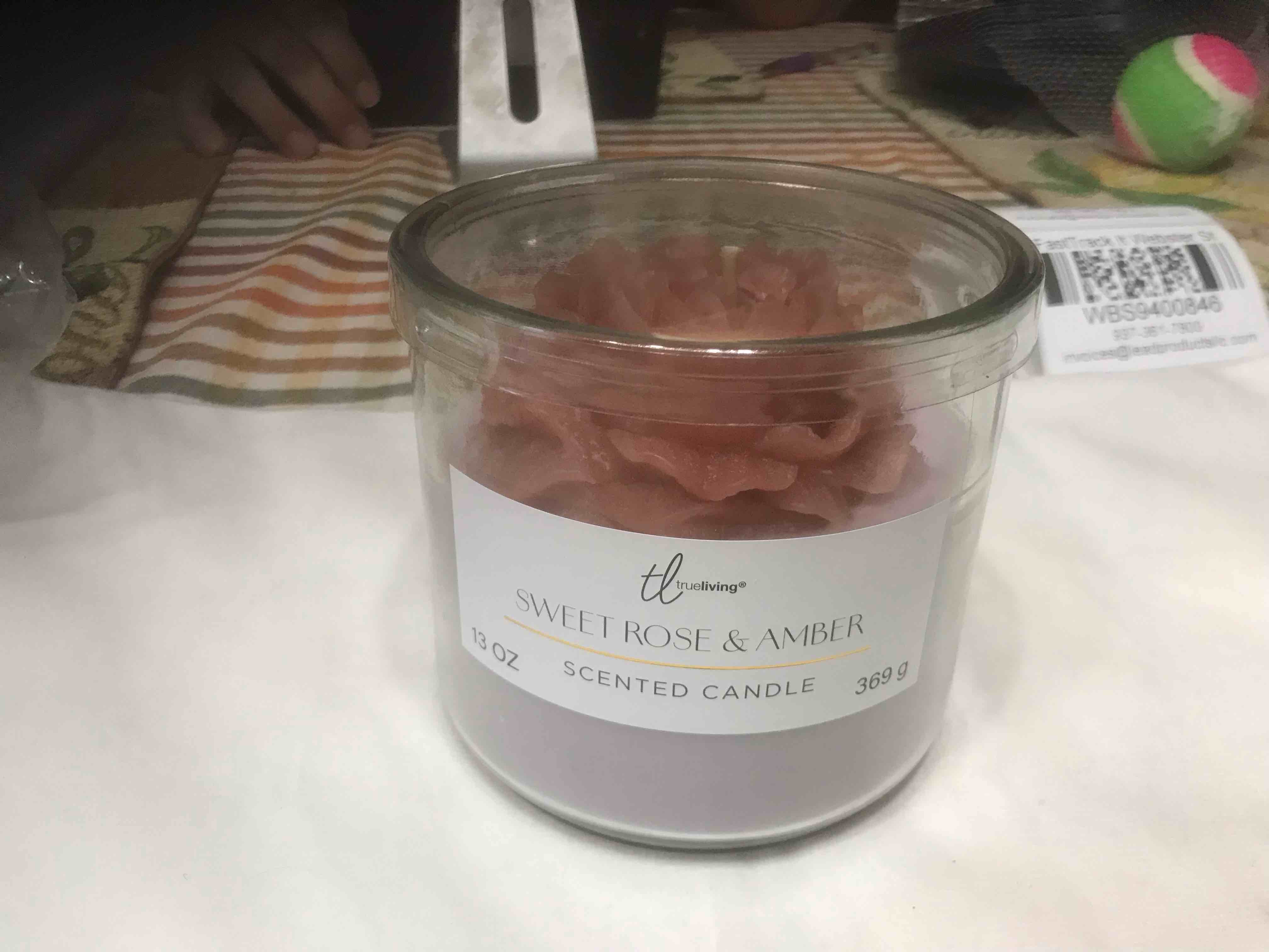 Condition photo showing New/Like New for sweet rose and amber 13 ounce candle