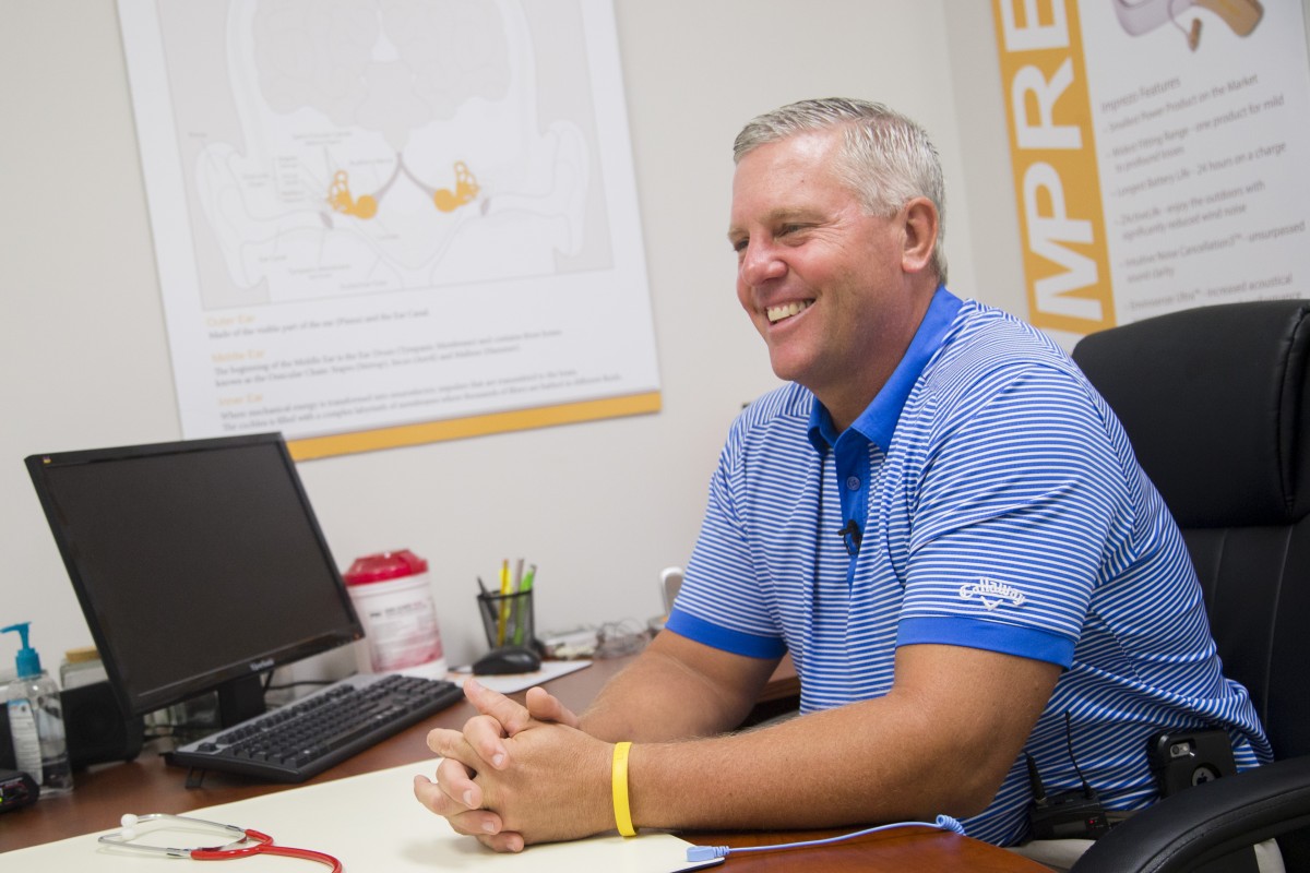 Man smiling during an interview